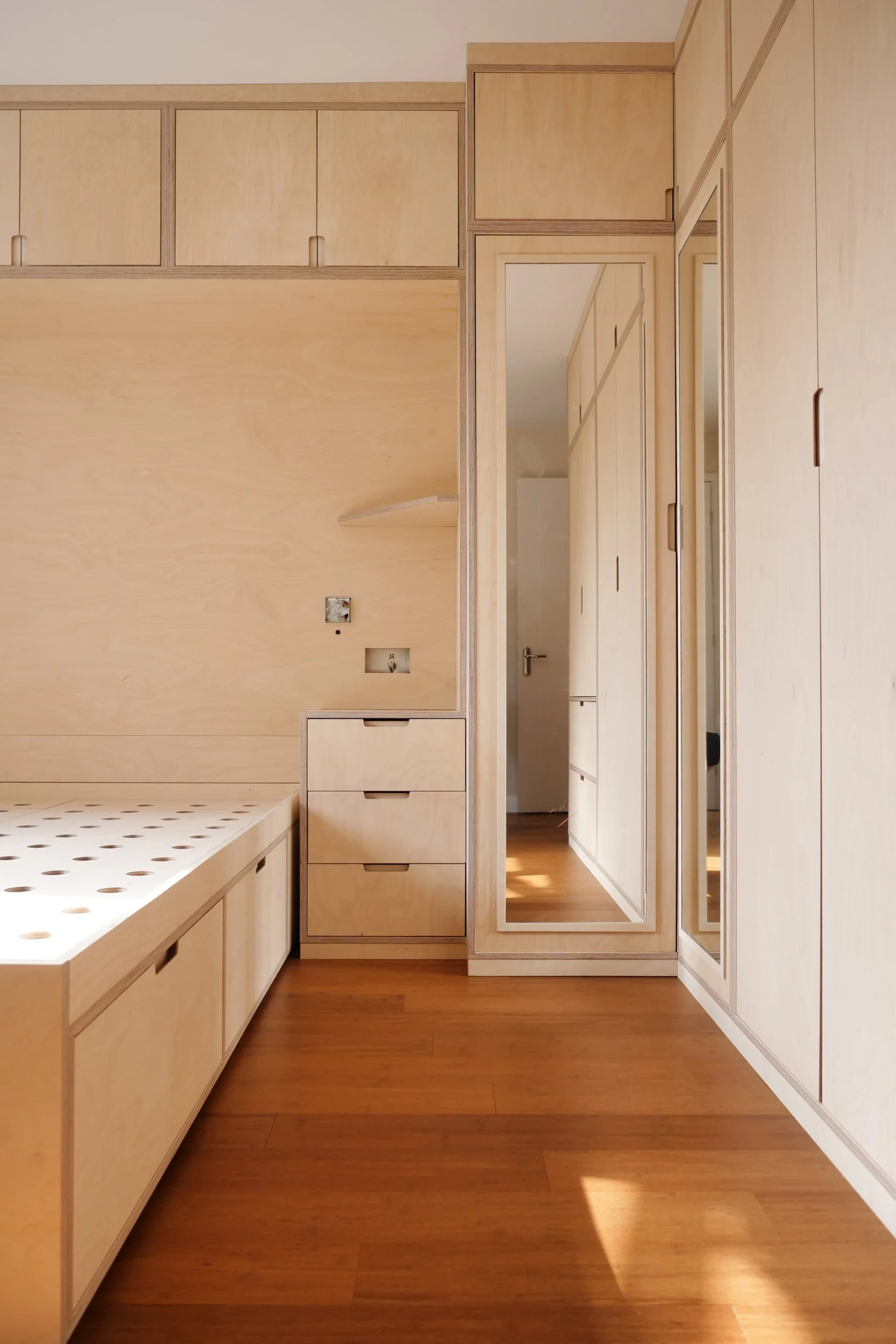 birch plywood bedroom wardrobes with mirror and bedside tables drawers bespoke bed contemporary fitted furniture local workshop somerset dorset devon wiltshire gloucestershire mendips cotswolds quantocks