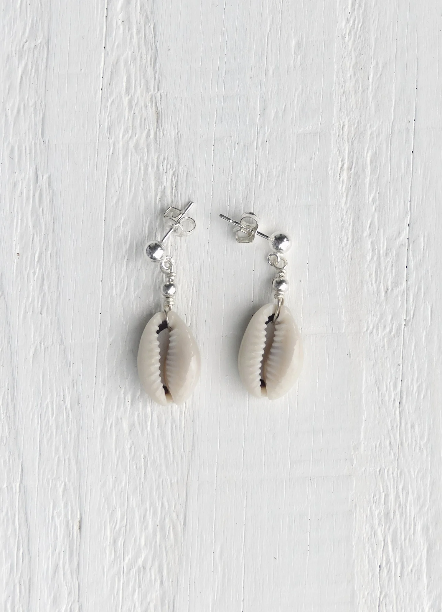 Cowrie-drop-earrings-two-in-the-sun.JPG