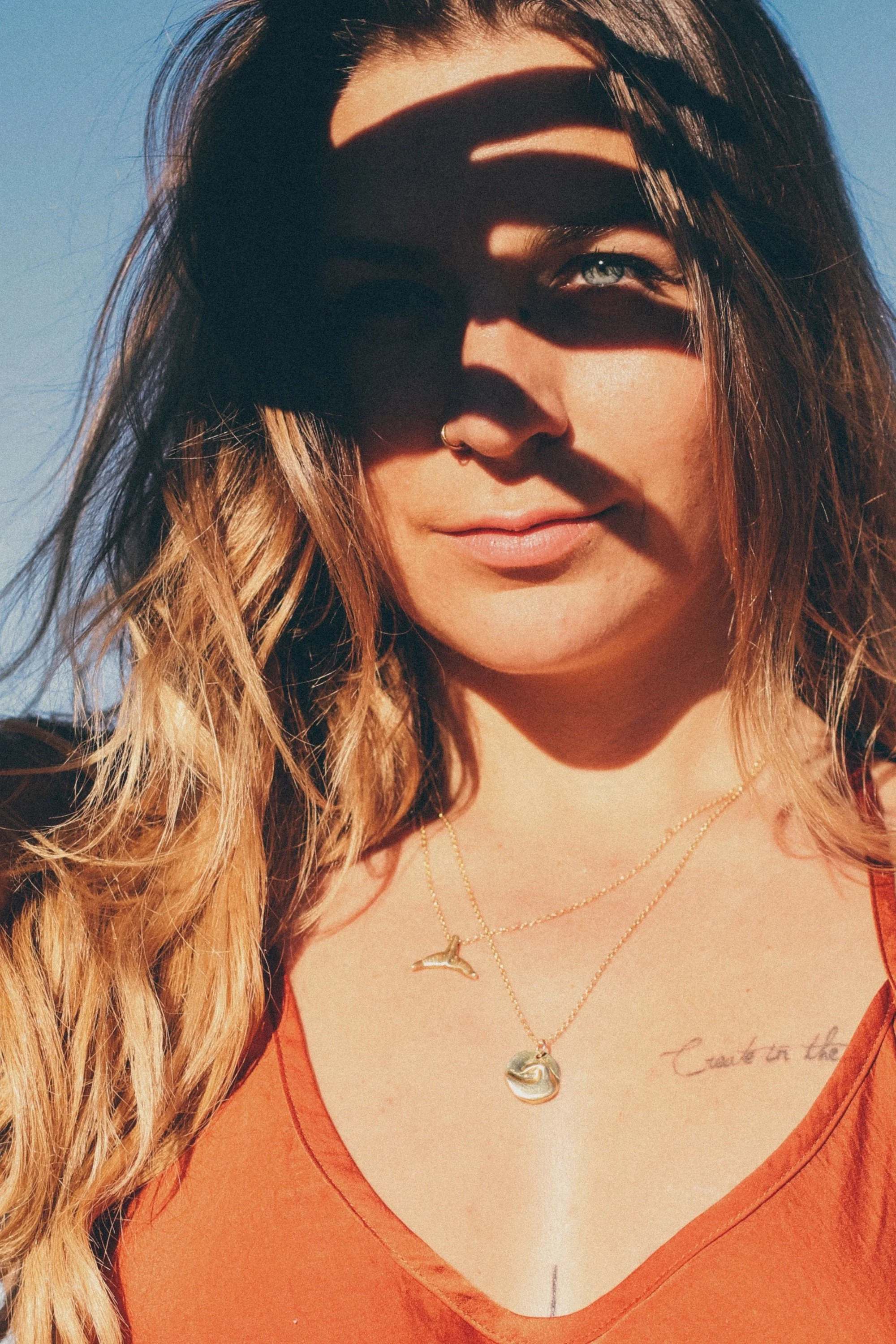 gold-ave-necklace-whale-tail-gold-chain-two-in-the-sun.jpeg