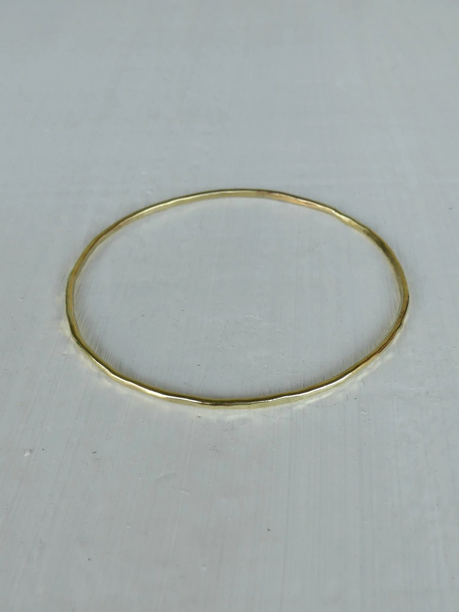brass-golden-hammered-bangle-two-in-the-sun.jpeg