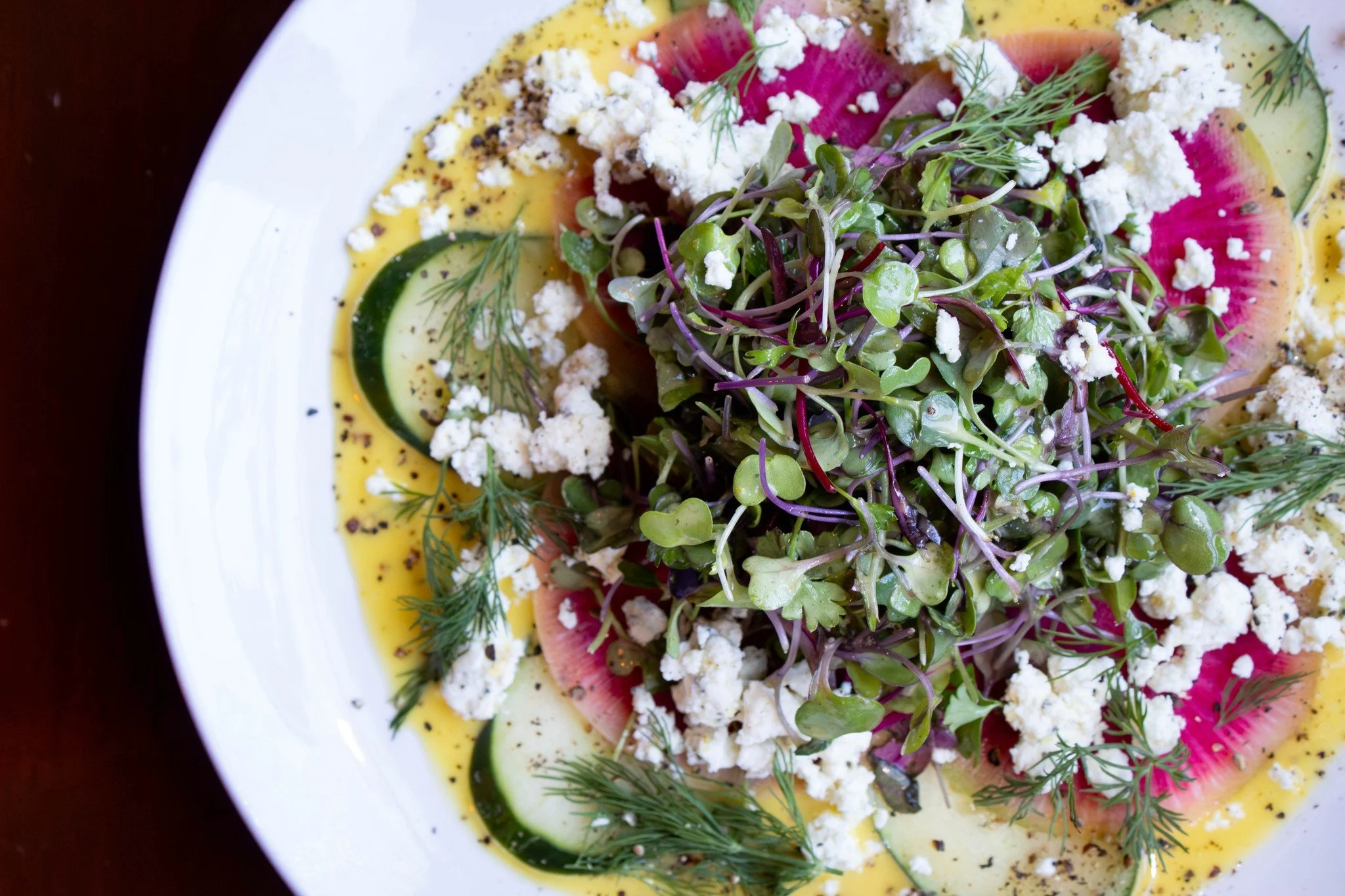 When it&rsquo;s cold and gray outside, a little color goes a long way.

Our Cucumber &amp; Watermelon Radish Salad is crisp, bright, and full of flavor. Microgreens, fresh dill, lemon thyme goat cheese, and citrus vinaigrette bring it all together. A