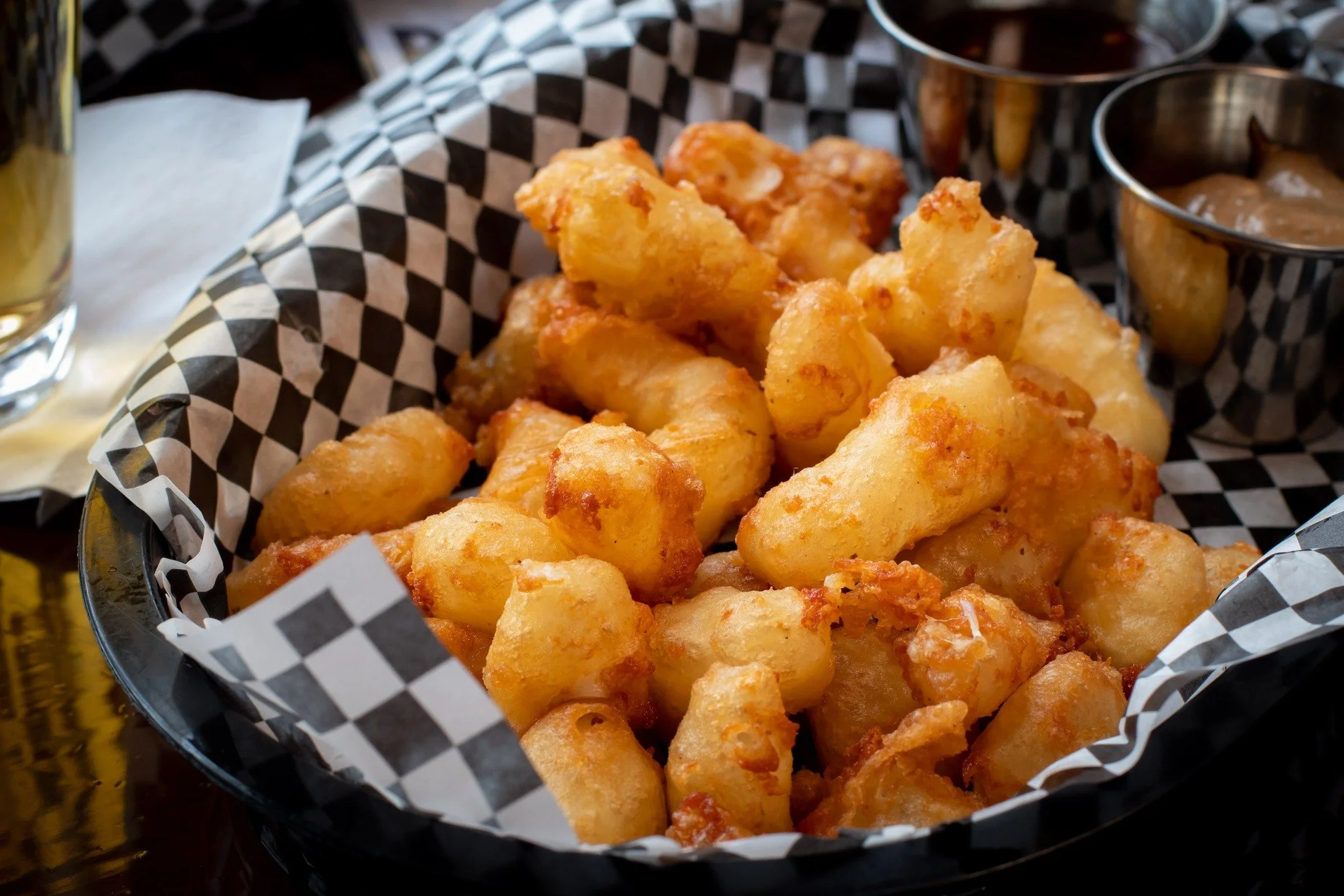 Golden, crispy, and exactly how cheese curds should be. @summitbeer battered, served with balsamic aioli and sambal honey for a little extra bite.