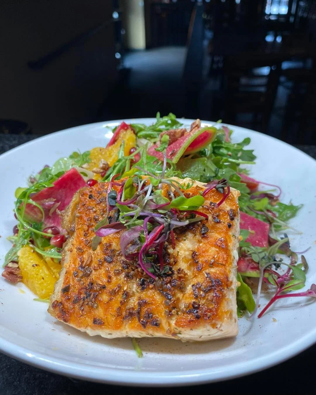 First Wednesday of the New Year! Kickin our 2026 specials off with a Salmon &amp; Pomegranate Salad 😋
Seared salmon fillet, arugula, pomegranate arils, watermelon radish, pickled fennel, orange segments, tri color tomatoes, and pecans tossed in citr