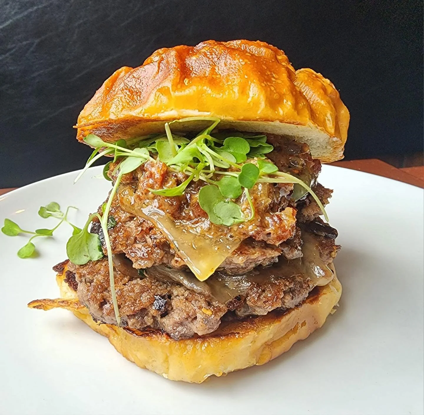 Happy Wednesday! 🍻

Our special this week is the Bourbon Bacon Jam Burger 🤤 herb mushrooms, bacon onion bourbon jam, micro arugula, and fontina on a pretzel bun. $17.50 available 1/28-2/3
Our wing flavor today is a Maple Bourbon Bacon sauce served 