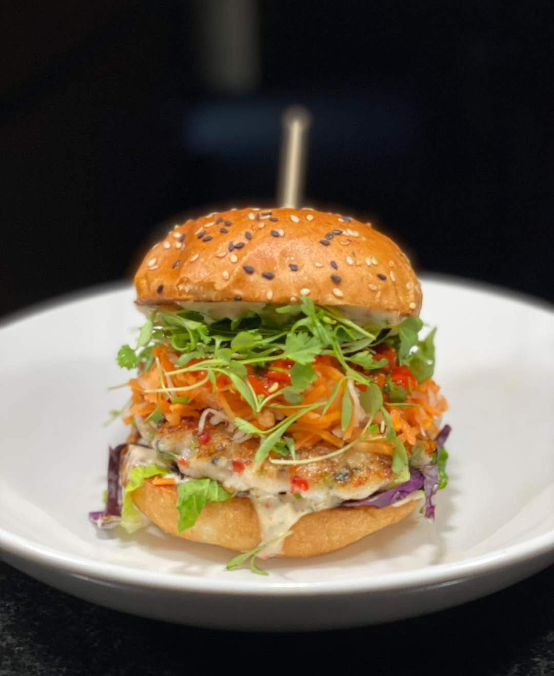 Our special this week is the Shrimp Burger 🤤
Housemade shrimp burger on a sesame seed bun with Napa cabbage, pickled daikon and pickled carrot, pickled Thai pepper relish (spicy!), micro wasabi and cilantro, with sweet chili aioli. $17.50 Available 