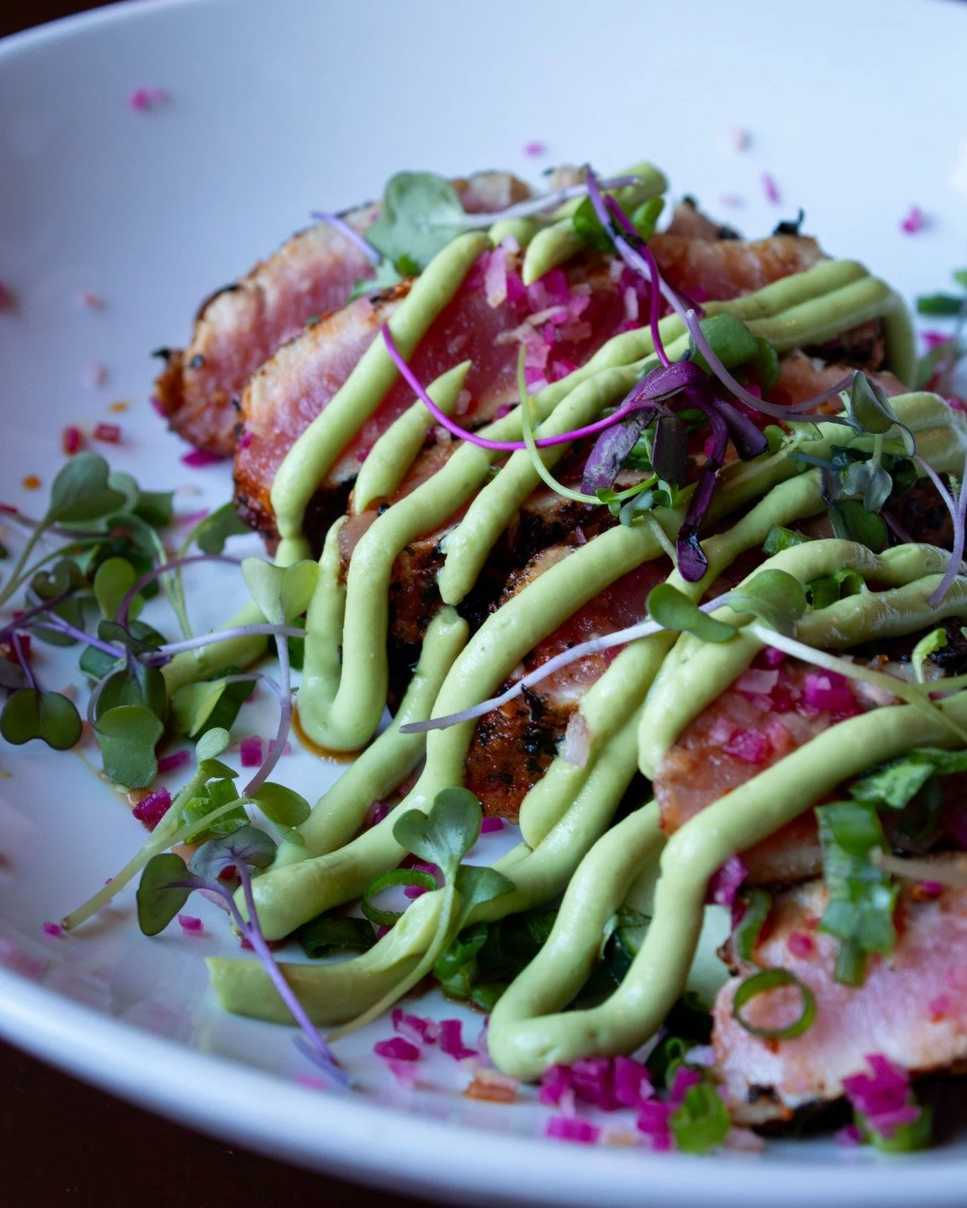 Togarashi Seared Tuna. Rare yellowfin, maple soy, green onion, watermelon radish, cucumber, microgreens, and avocado cream. 

Fresh. Bright. Done right.