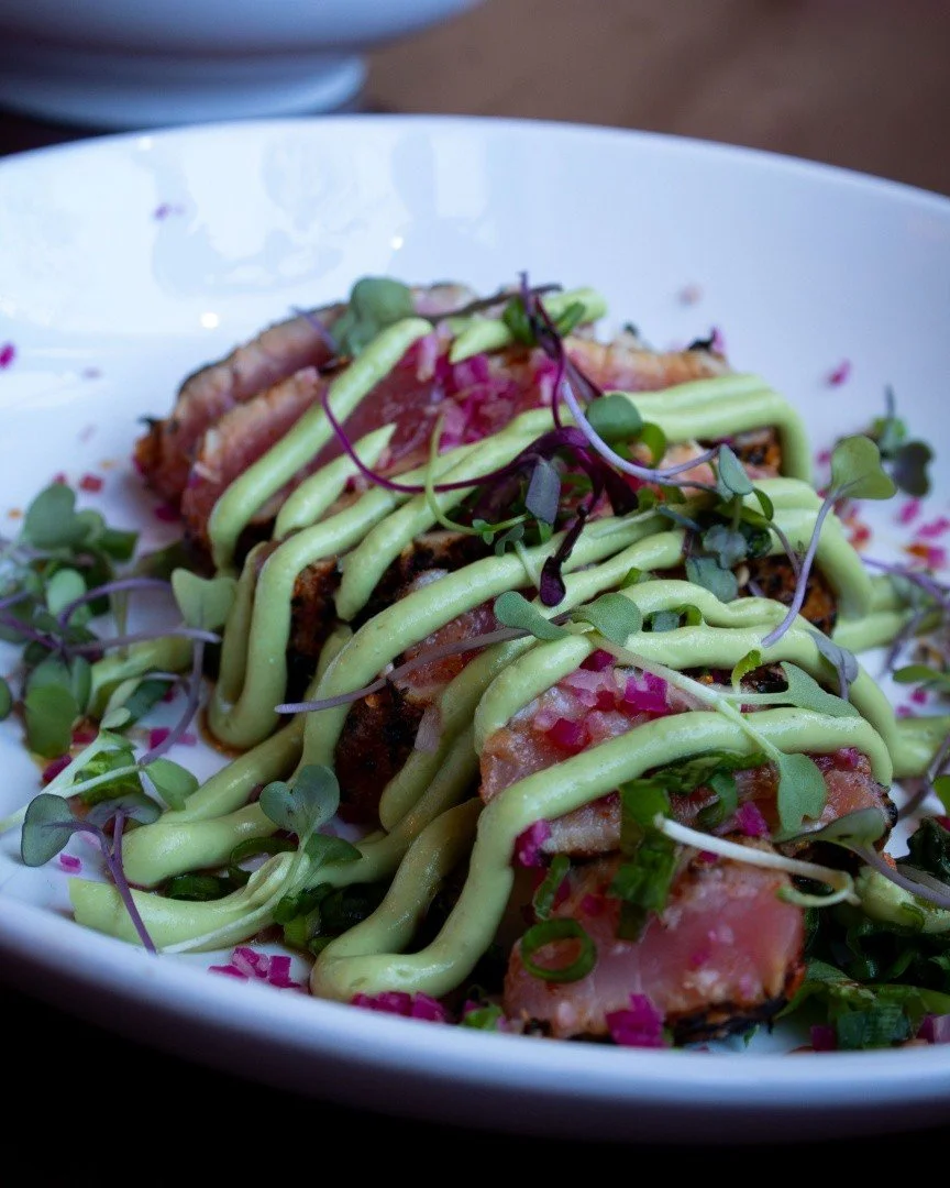 Fresh, bright, and just the right amount of heat. Togarashi Seared Tuna with maple soy, green onion, watermelon radish, cucumber, microgreens, and avocado cream.