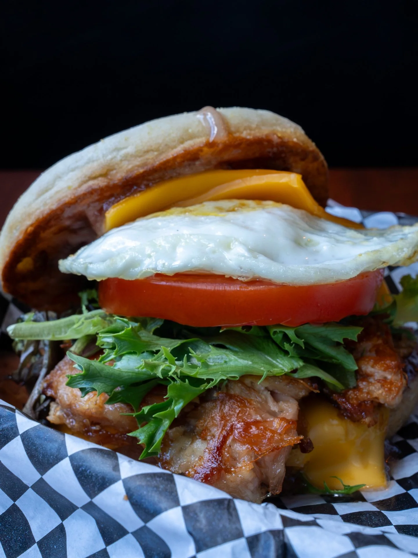 Brunch, stacked.

Pulled bacon, an over-easy egg, cheddar, tomato, mixed greens, strawberry preserve aioli, and an English muffin.

Saturdays &amp; Sundays, 11am&ndash;2pm.