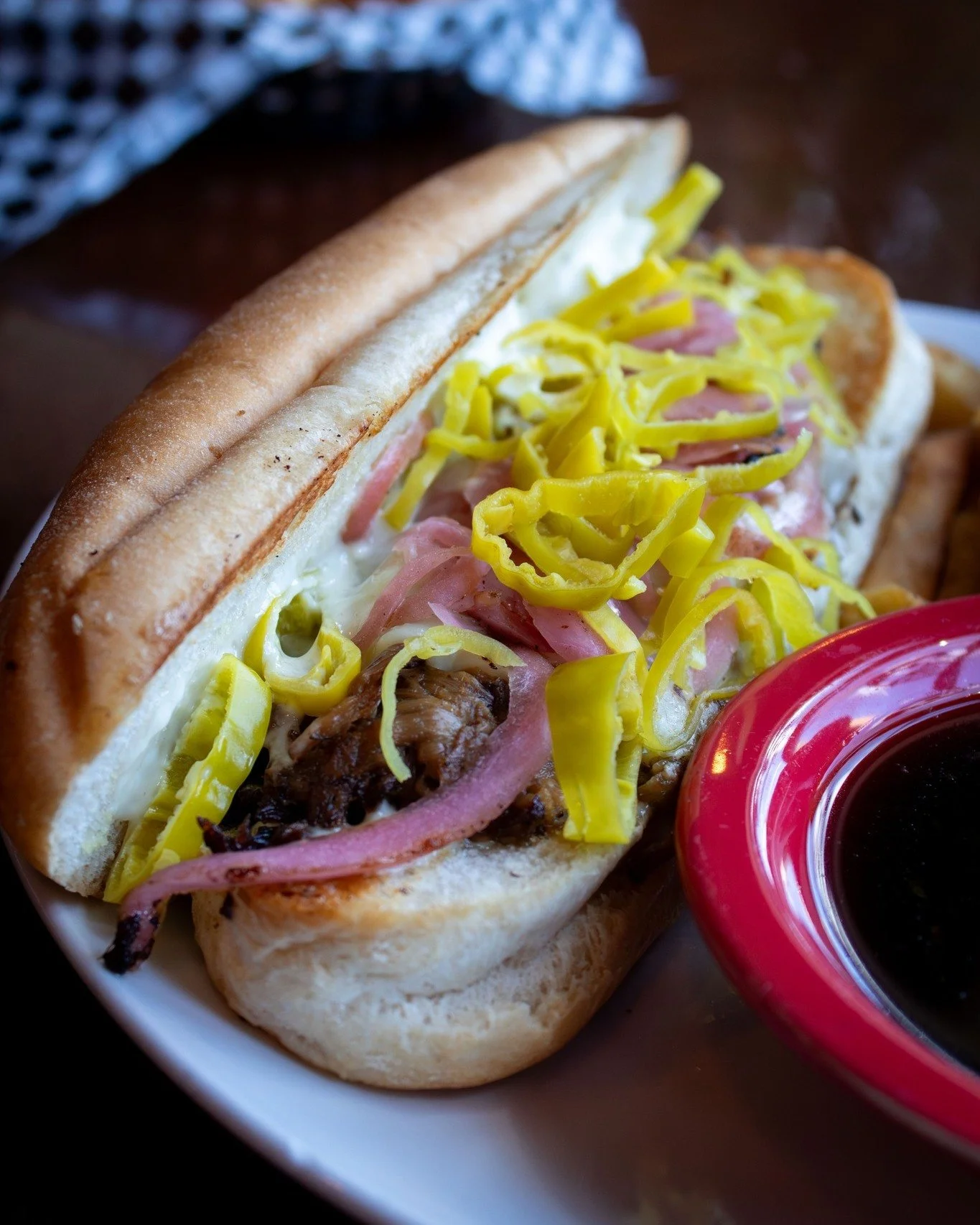 Our Payne Ave Dip. 🤌 Braised beef, pickled red onions, pepperoncini, Swiss cheese, and garlic aioli on a toasted hoagie roll, with a side of zesty au jus for dipping.

Grab a napkin and dig in. See you at the Pub! 🍻