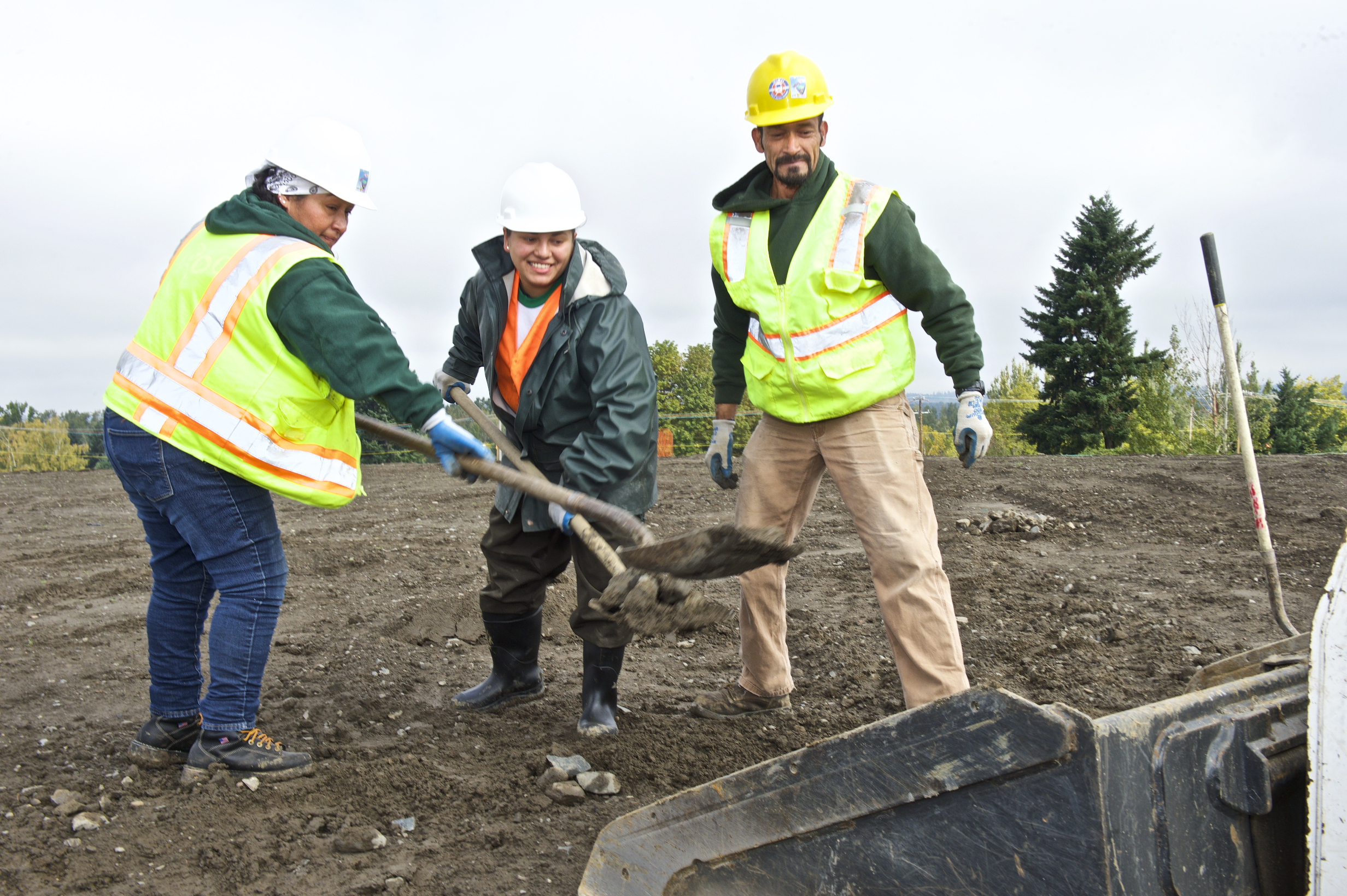 Verde Landscape Crew Member Rosa, Karen and Antonio prepare the grading at Cully Park.