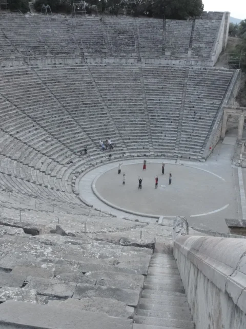 Phillip Zarrilli leads preliminary breathing exercises in the ancient theatre at Epidavros, 2011.