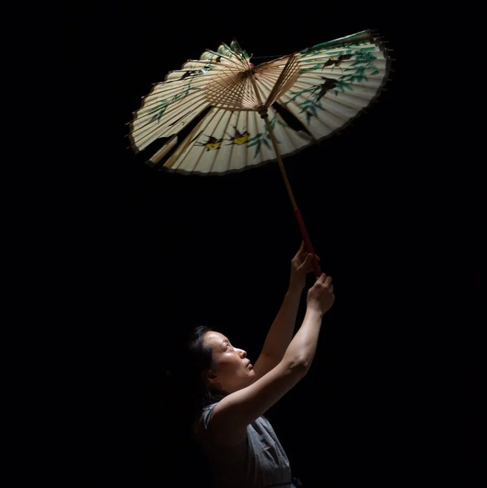 Jeungsook Yoo as Woman with Parasol, Scene 3.