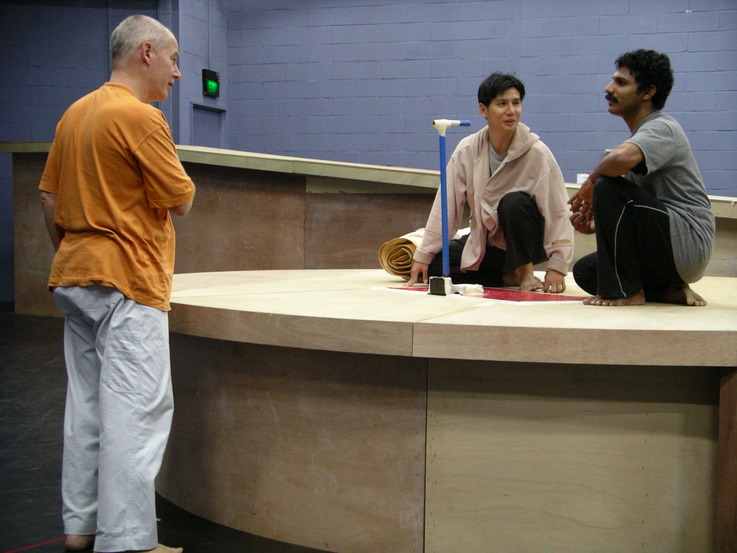 Phillip Zarrilli in rehearsals of Scene 2 with Pern Yau and Naushad (Man 1 and Man 2) for the 2004 TTRP production of Ota Shogo's The Water Station.