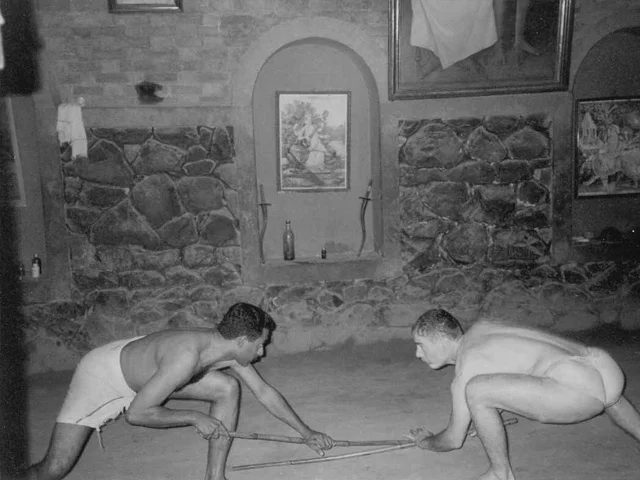 Sathyan Narayanan Nayar and Phillip Zarrilli practicing long staff.