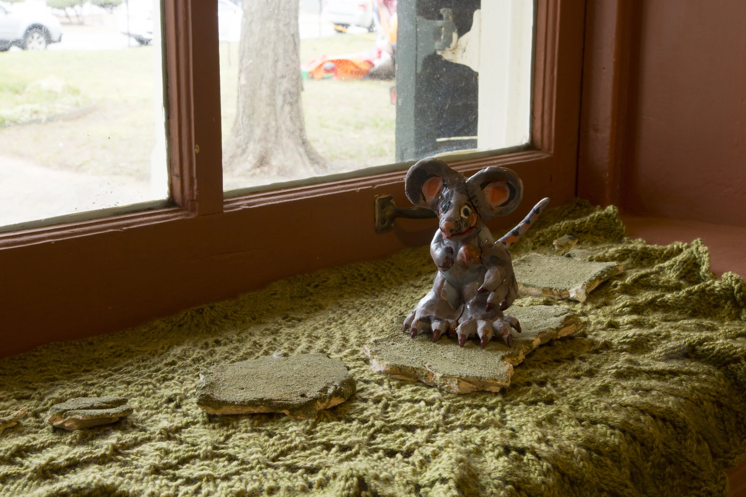 As soon as it was dark and the scientist left for the night, the Milking Mouse was able to slip through her cage. She glanced back over her shoulder to get one final glimpse of the clock as she headed out onto the sidewalk along the shed. Image by Kristoffer Johnson