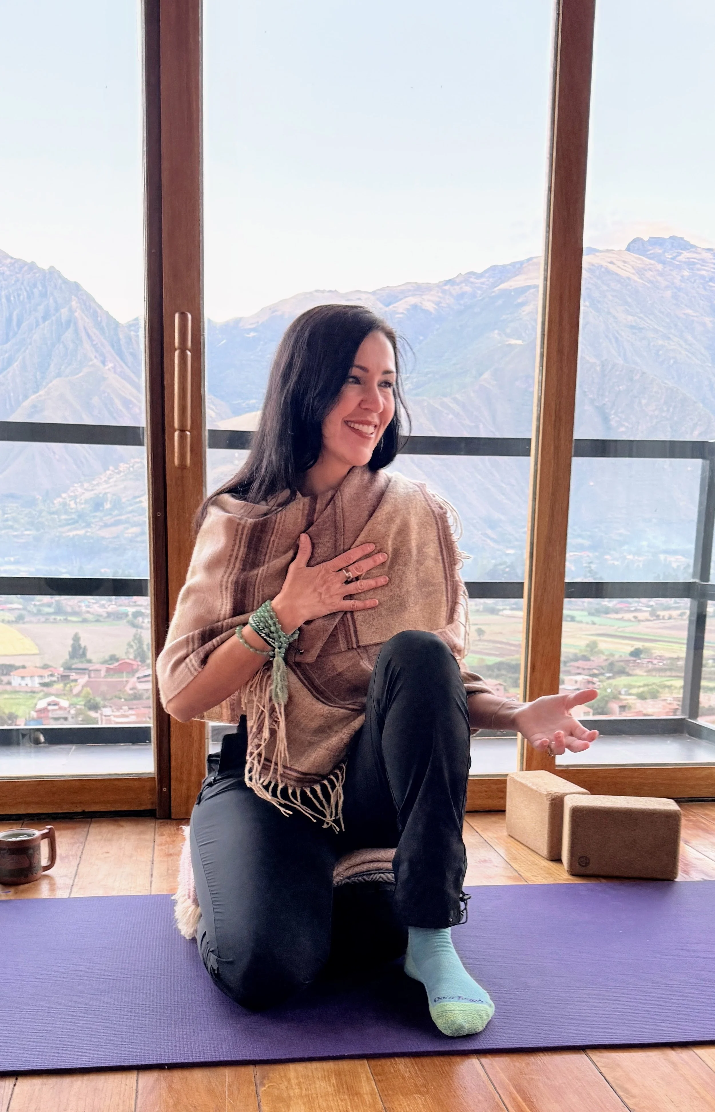Joni Staaf-Stamford guiding a morning mindful yoga class during a retreat in the Sacred Valley of Peru.