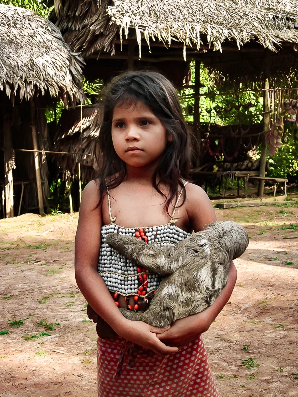Little Girl with Sloth in the Amazon, Peru
