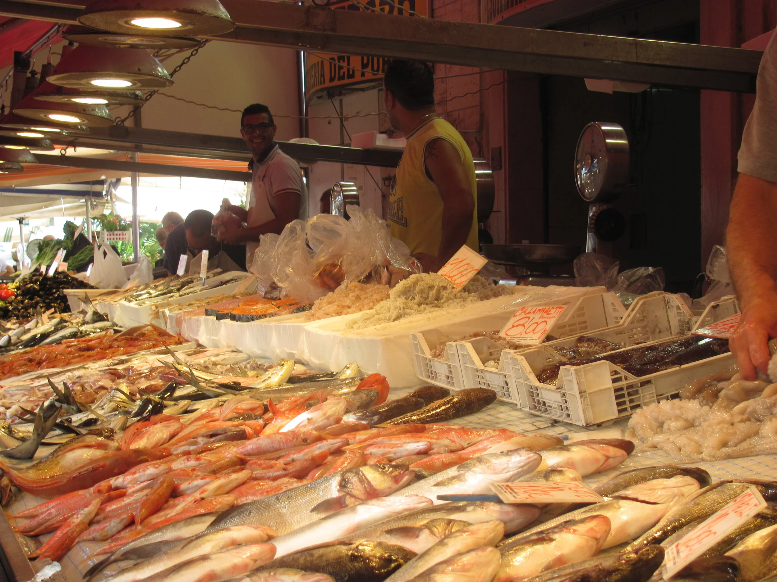 Fish mongers at the market yelling their catch