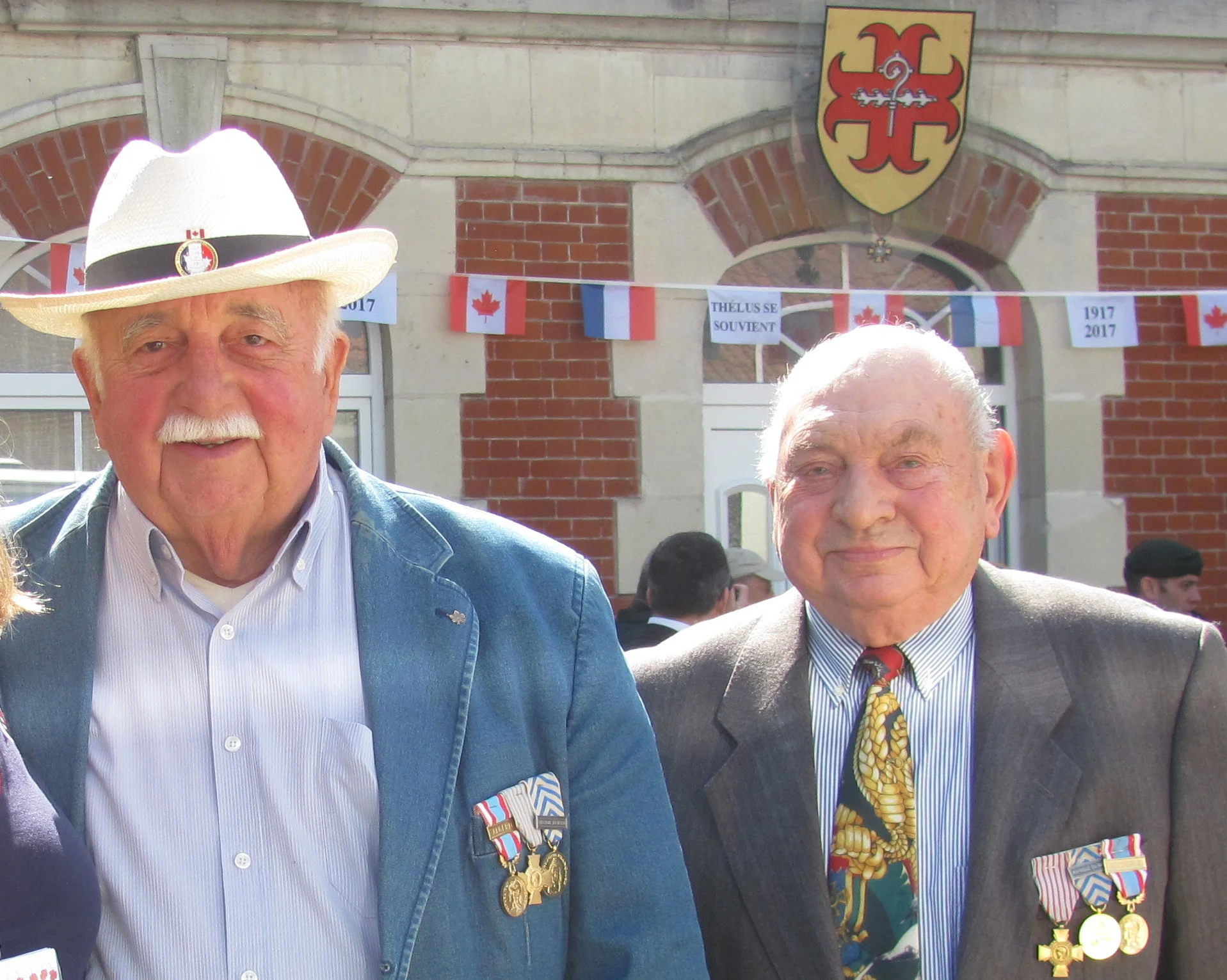 Thelusian French veterans of the Algerian war attended and mixed with Canadians guests. Thelus coat of arms can be seen in the background.