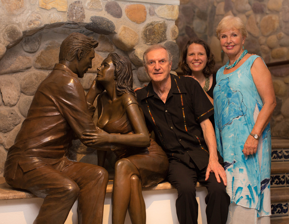Jim Demetro, daughter Christina, and wife Eva, with sculpture Los Amantes.