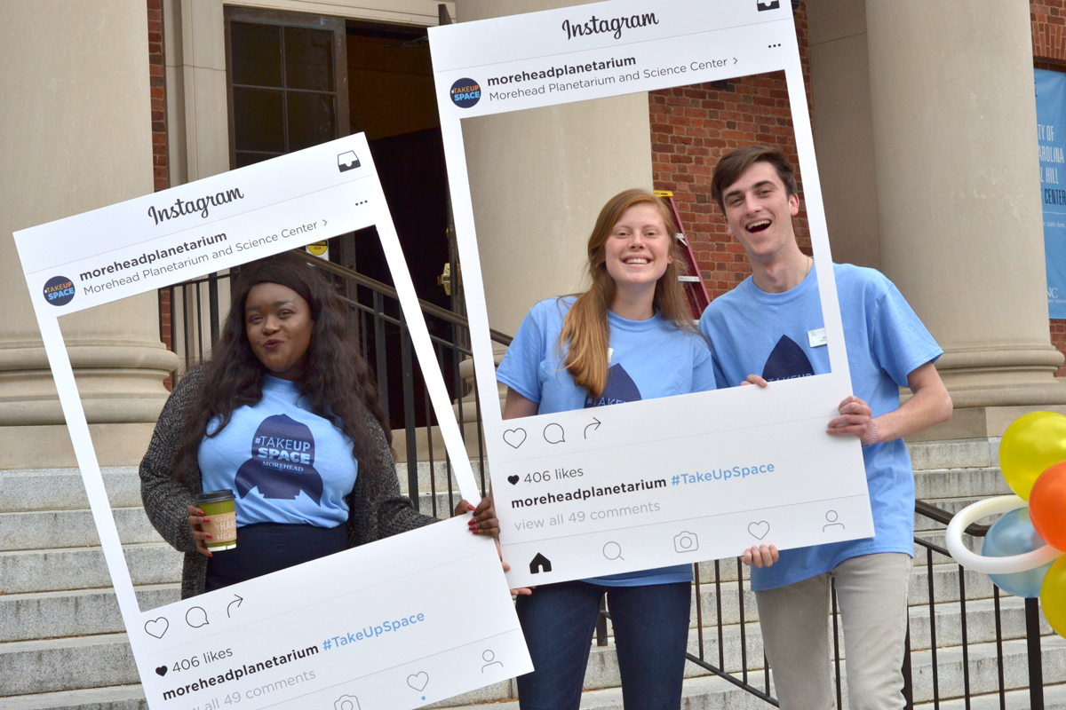 Student employees pose for photos while wearing the event's 1-color #TakeUpSpace t-shirts.