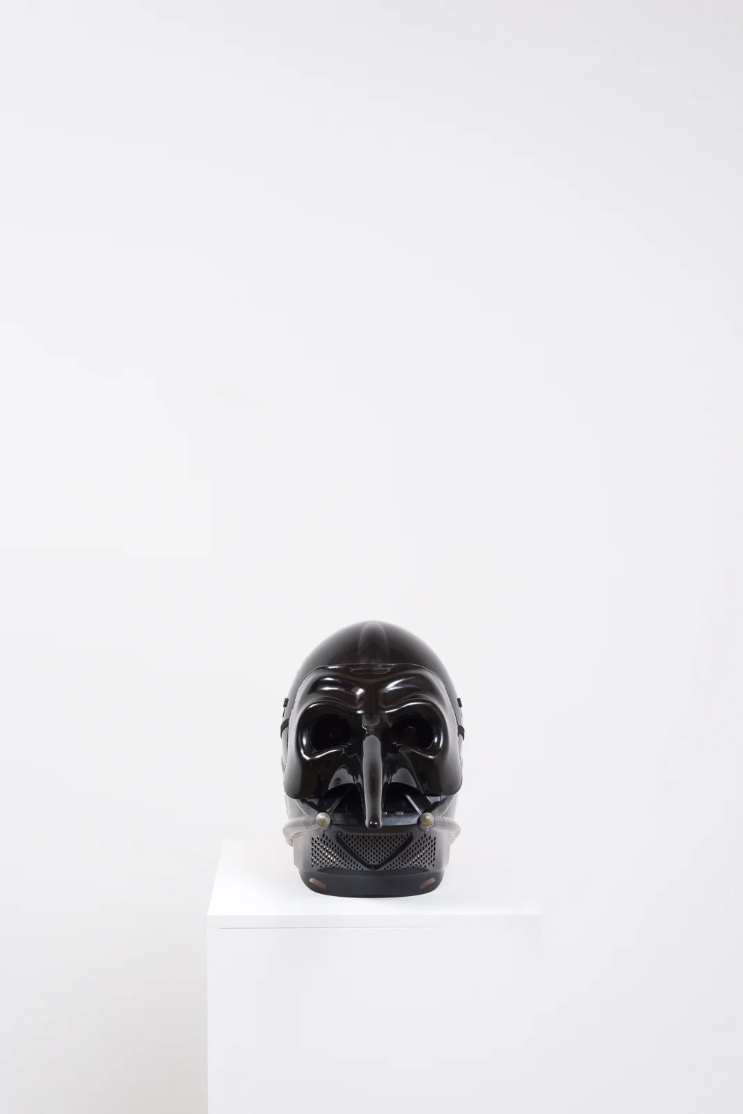Pumpkin in a Mask in a Mask, 2017 Foam pumpkin, plastic masks, pedestal