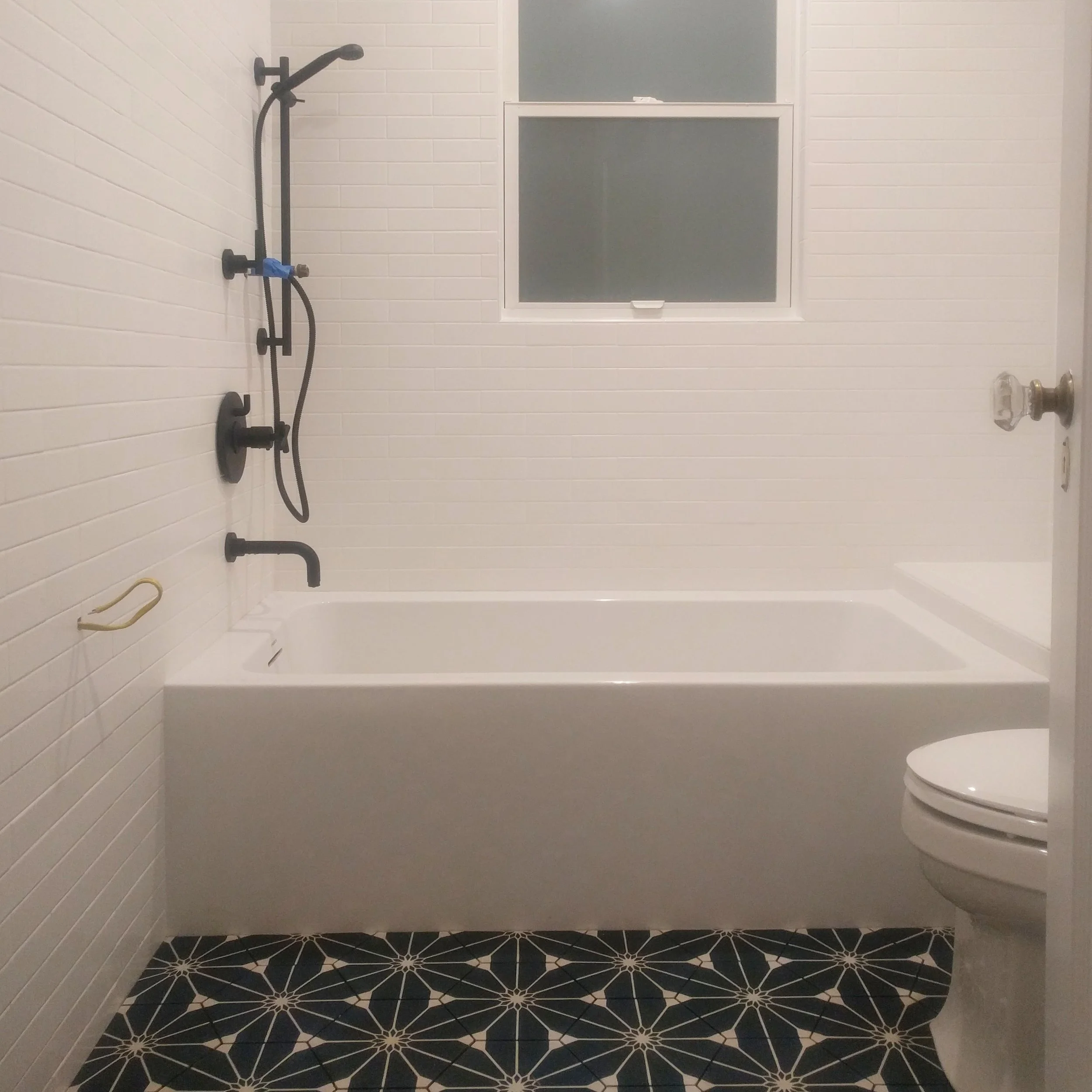 The (unfinished) bathroom, before the grout.