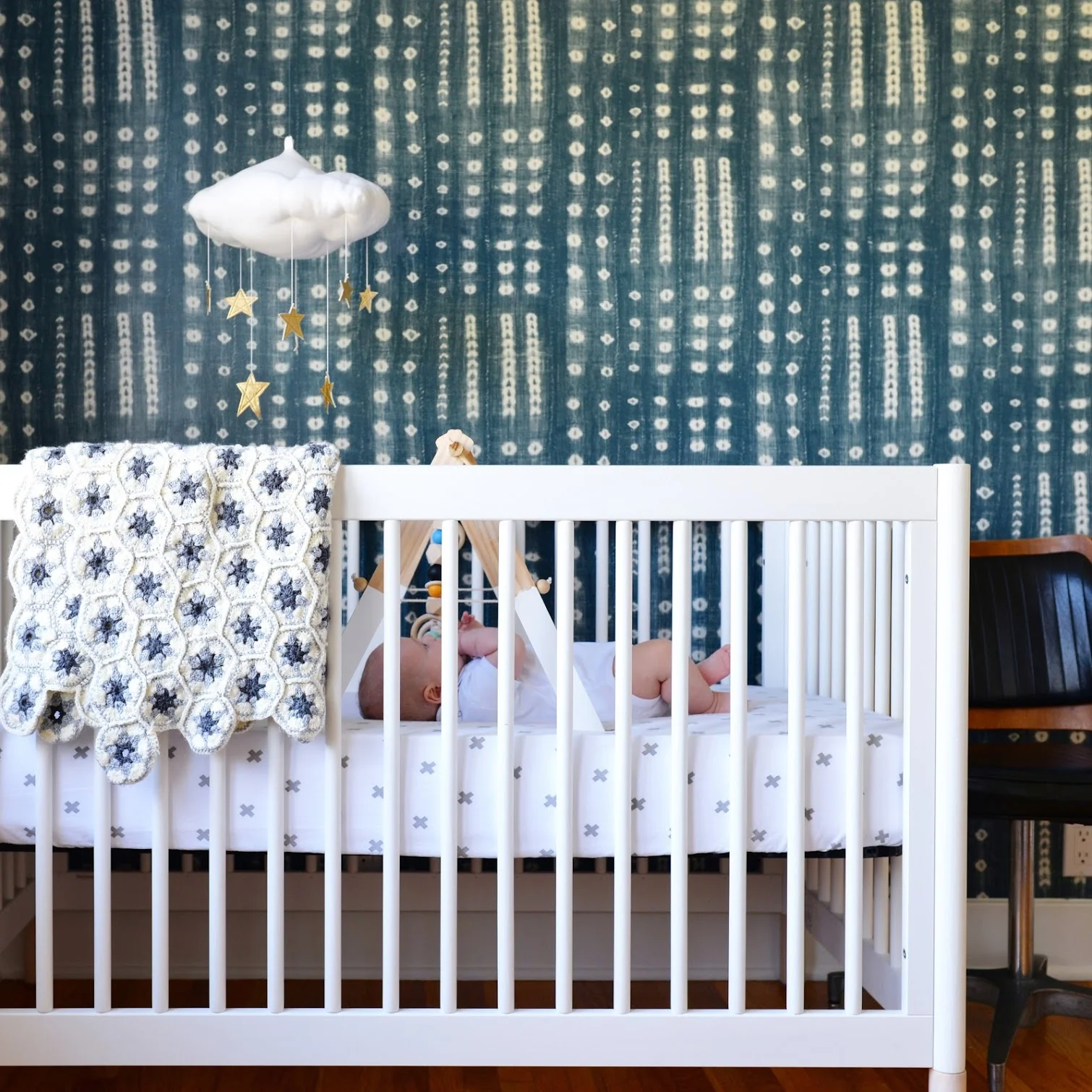 I love this accent wall -- I'm so happy with it! The wallpaper is from Shoppe by Amber Interiors . Megan suggested the wallpaper, and I was hesitant at first: would I get sick of it? Would the baby rip it off? But I love love love it. The wallpaper brings color and fun into the room, in a grown-up way.