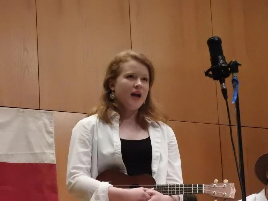 Emily Hardey performing on stage with Cougar Roots in Dudley Recital Hall.