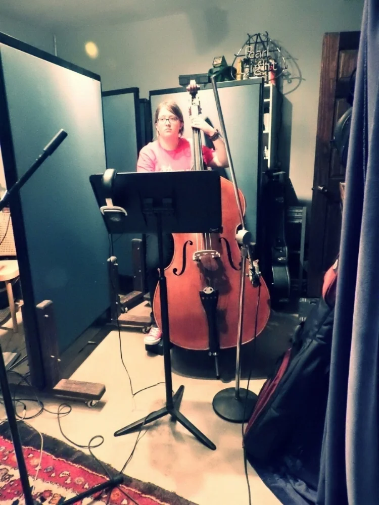 Kyrie Bouressa recording with Cougar Roots in Paul Beebe's Studio.