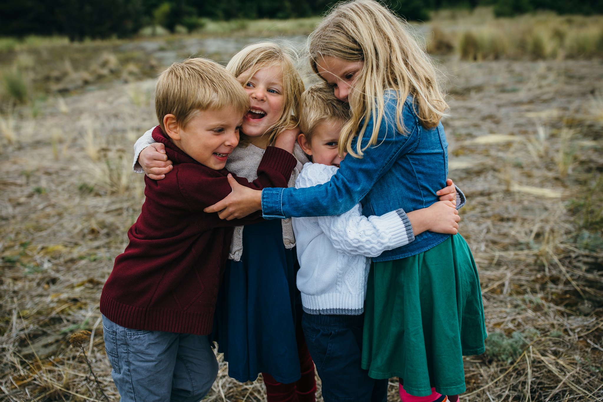kara chappell whidbey island family photography siblings hug and laugh and deception pass state park