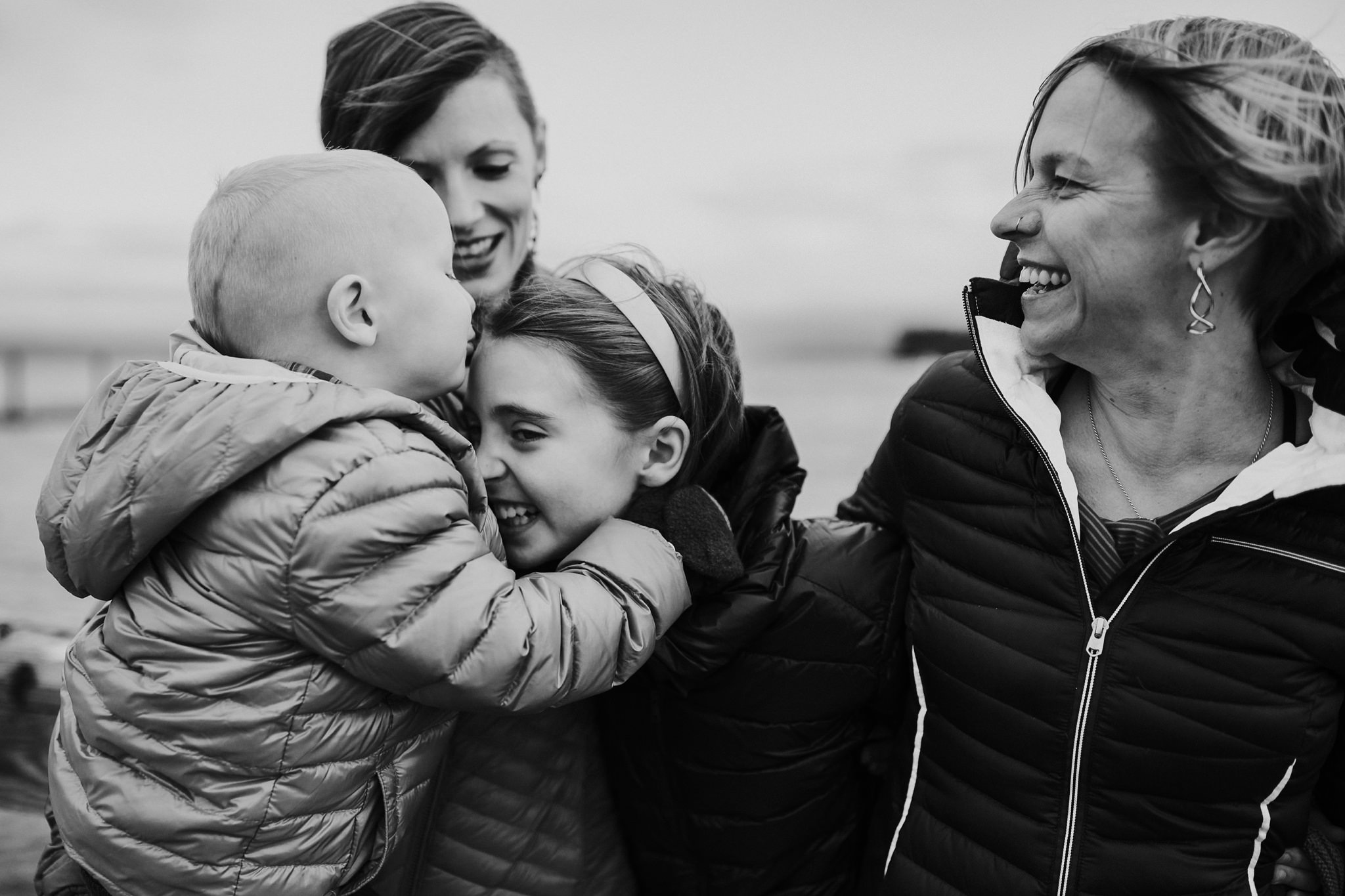 Lesbian parents snuggle kiddos on Coupeville Wharf | Coupeville, WA Family Photographer