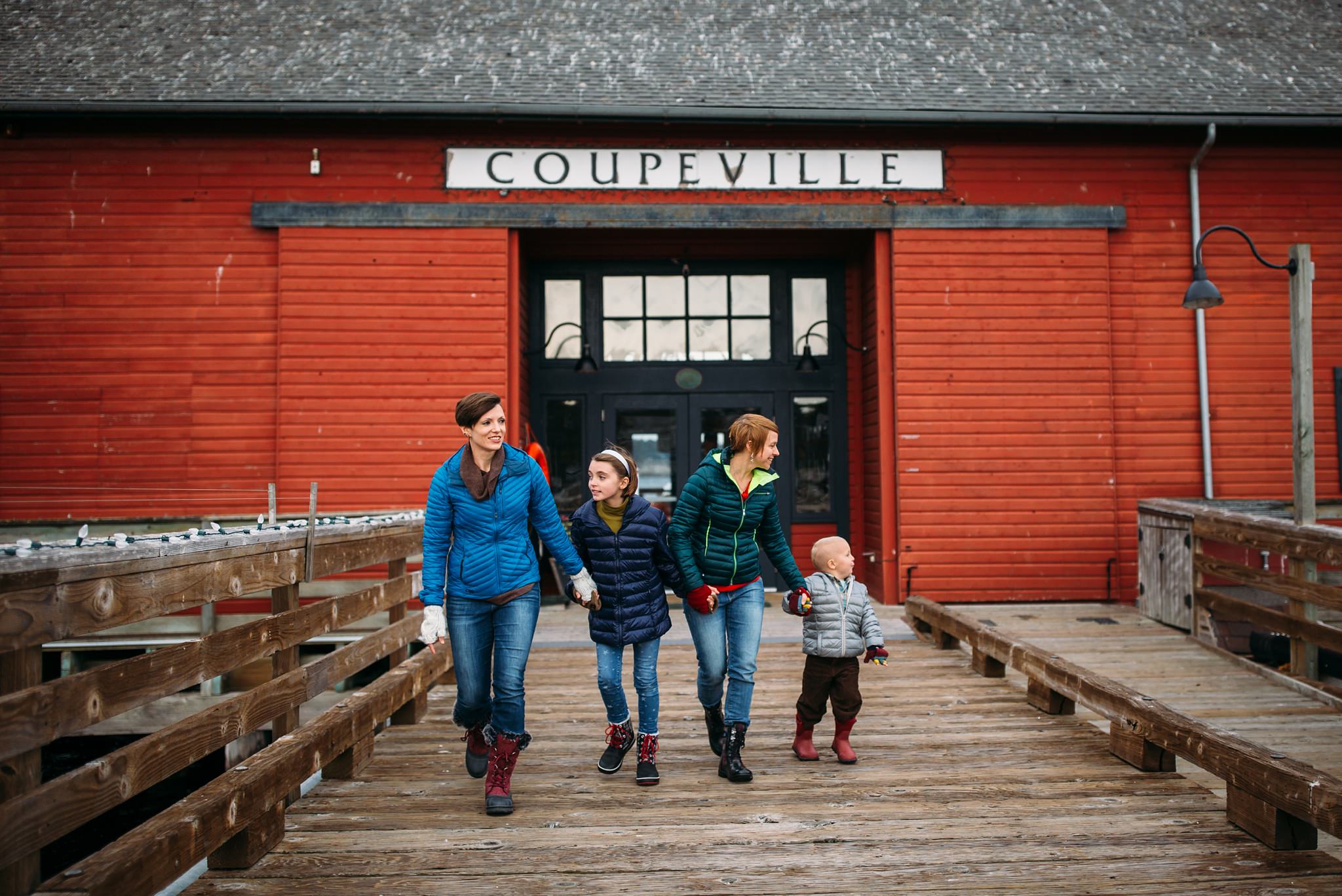 Same-sex couple run down wharf with kids | Coupeville, WA Family Photographer