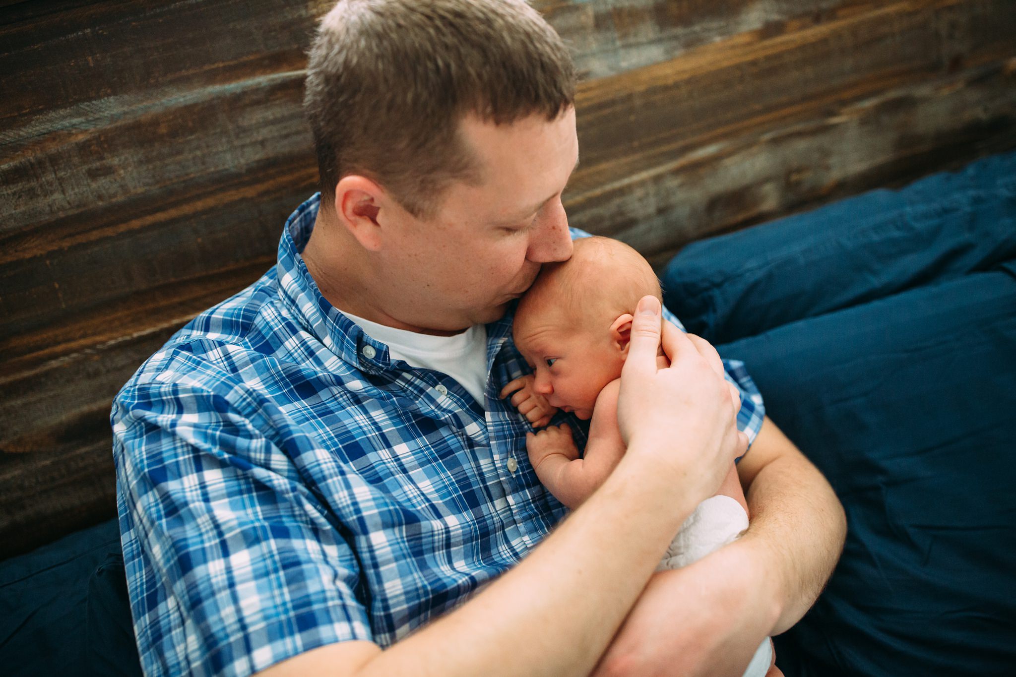 Beautiful Family Snuggles Baby on Bed | Whidbey Island Newborn Lifestyle Photographer