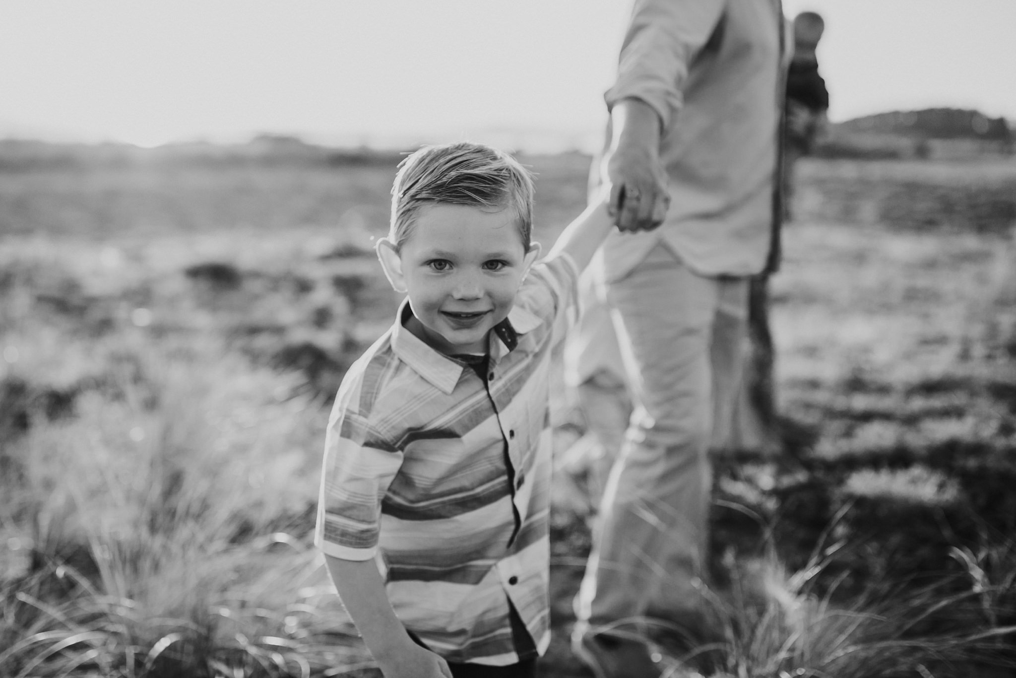 Little boy pulls dad along beach | Whidbey Island Family Photographer