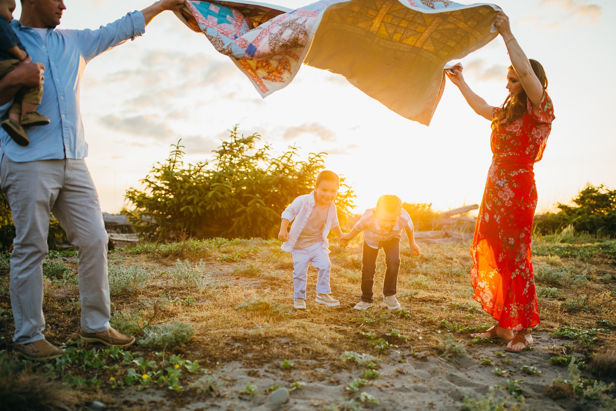 Parents play games with children on Washington beach | Whidbey Island Family Photographer