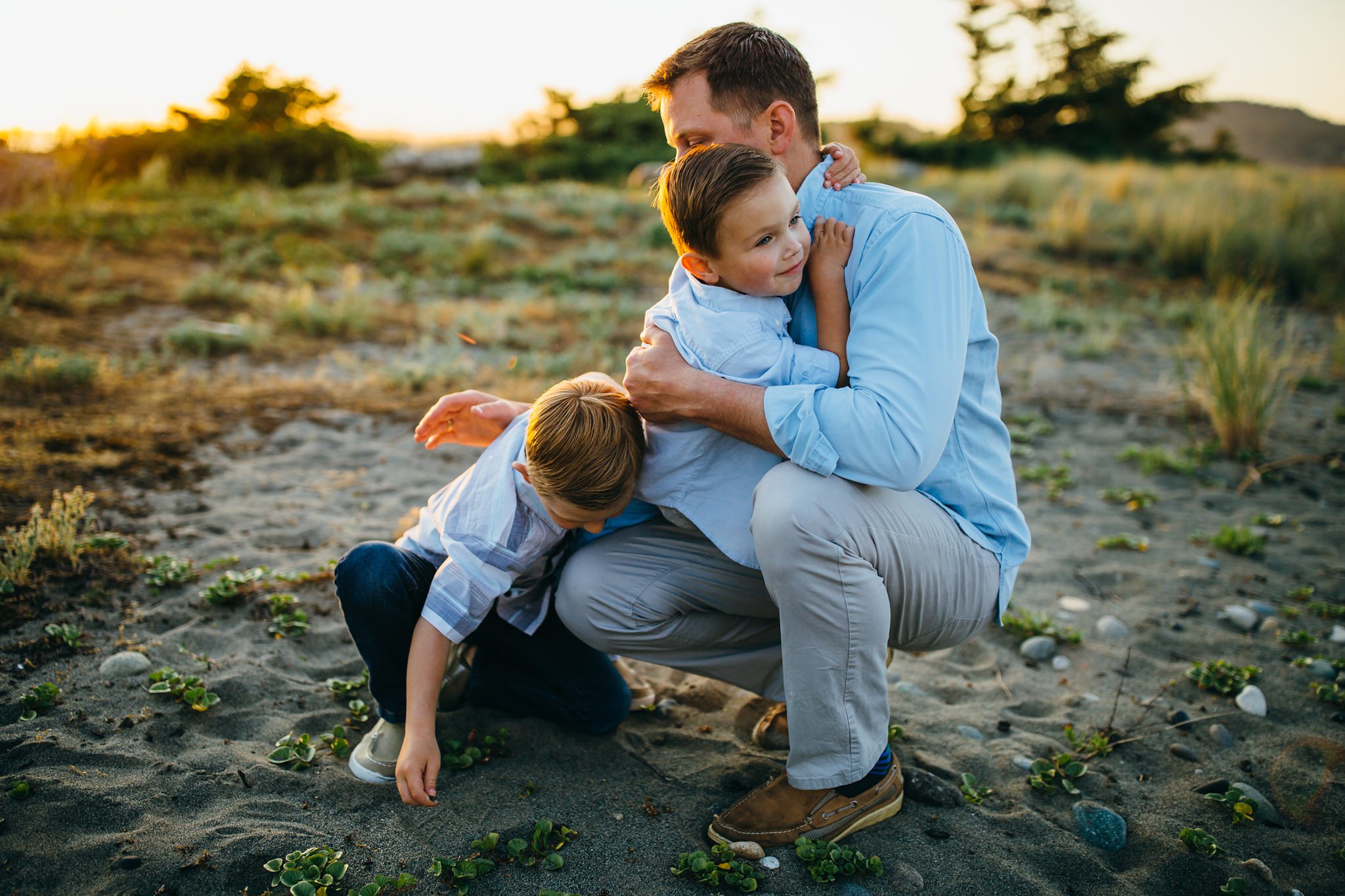 Dad hugs boys on Washington beach | Whidbey Island Family Photographer