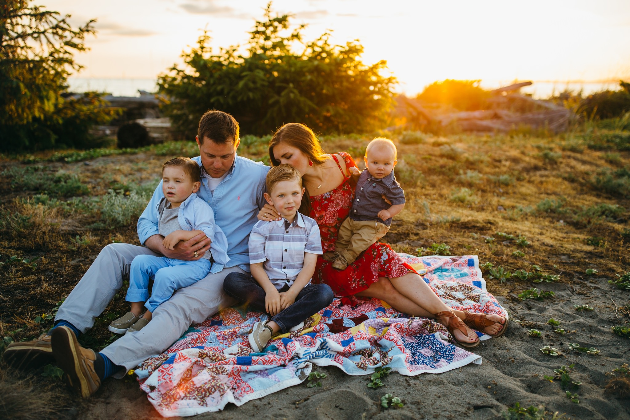 Family sits in field | Oak Harbor Family Photographer