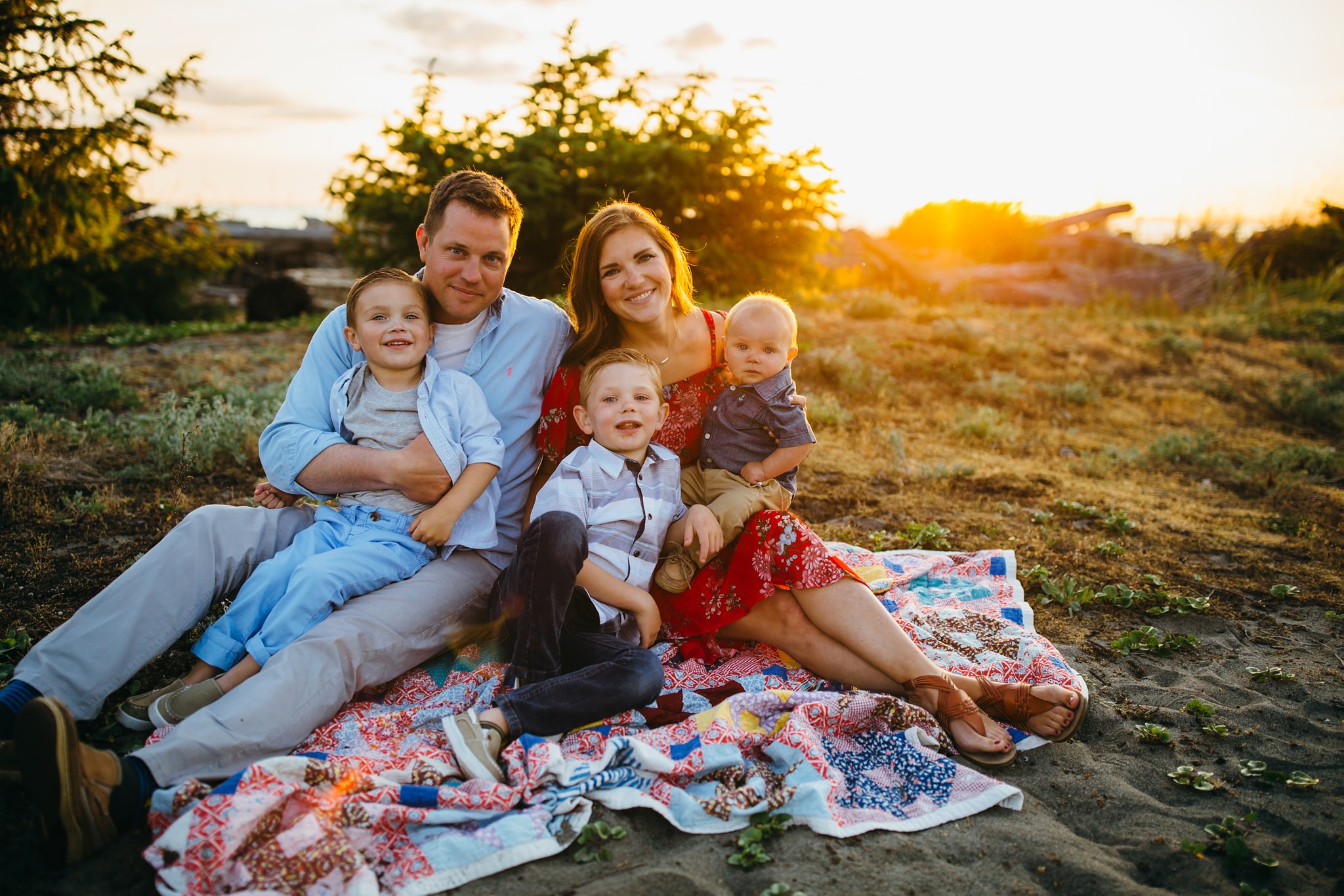 Family snuggles on blanket | Oak Harbor Family Photographer