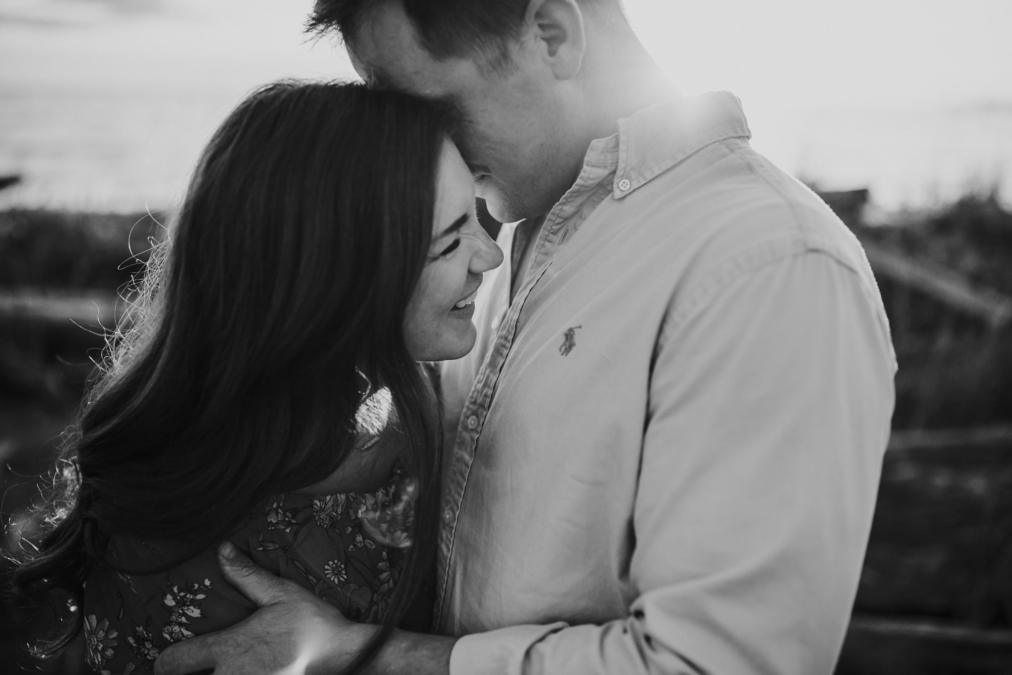 Couple laughs at Deception Pass beach | Oak Harbor Family Photographer