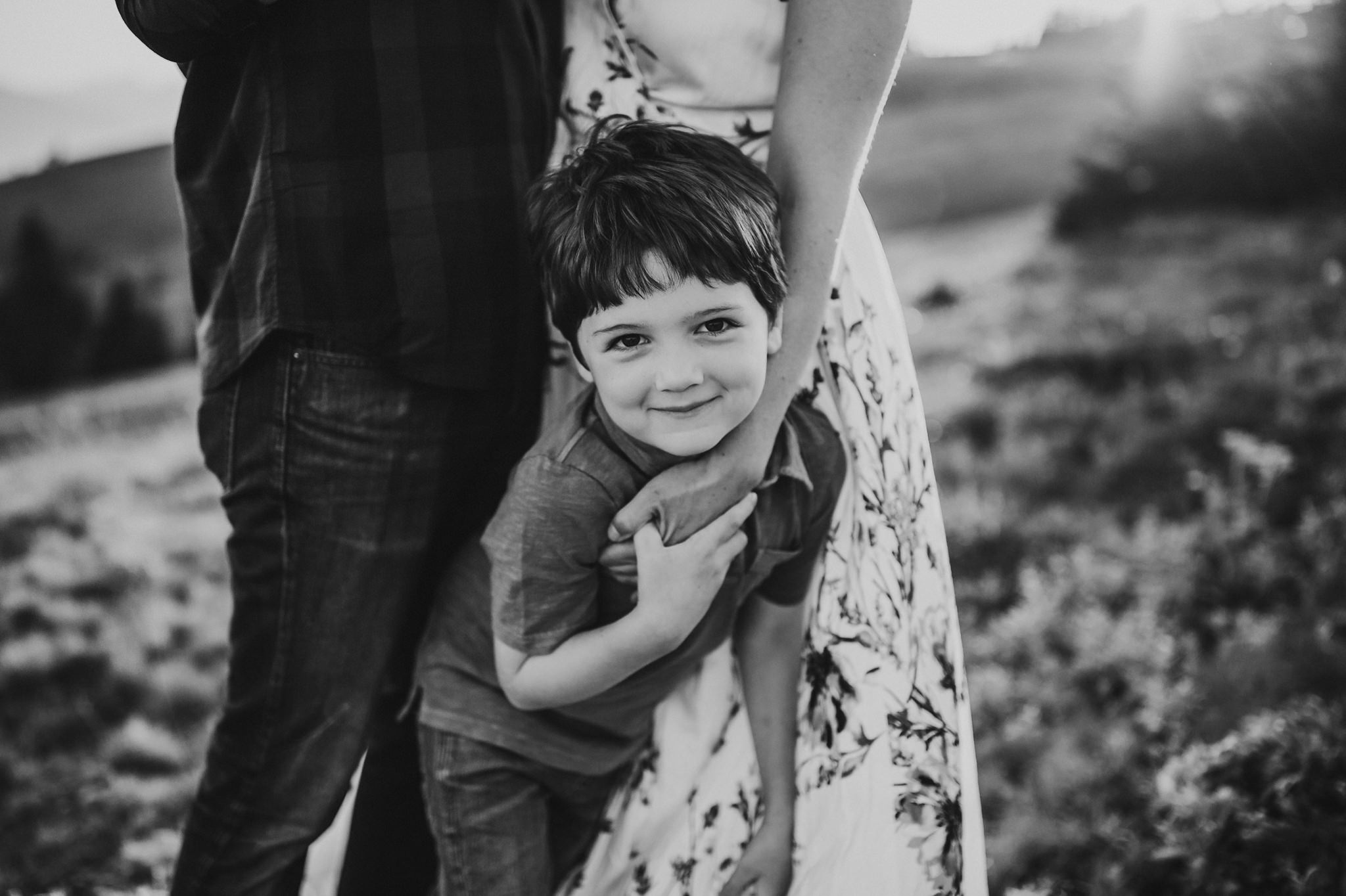 cute boy hugs mom's hand at hurricane ridge