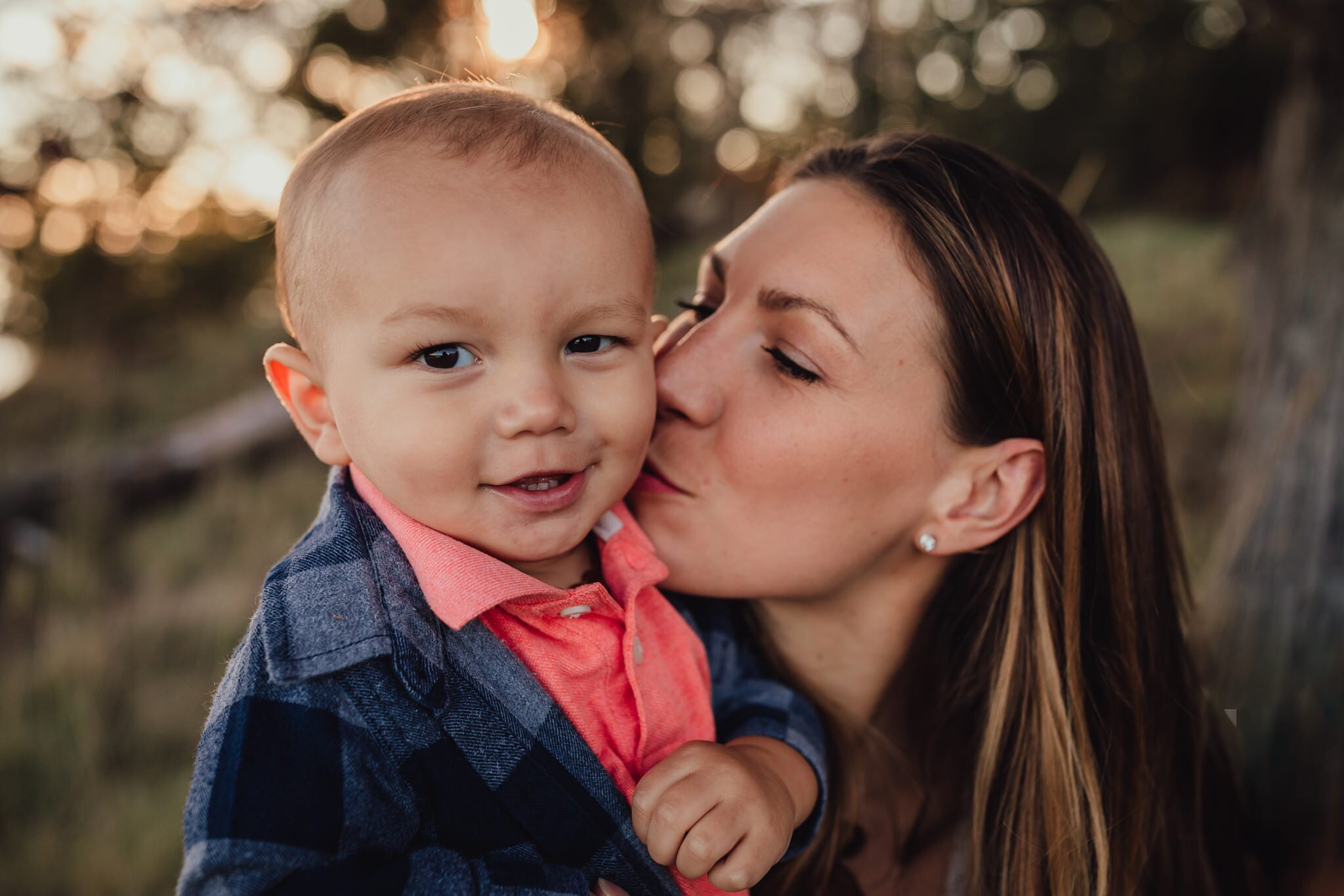 mother kisses son