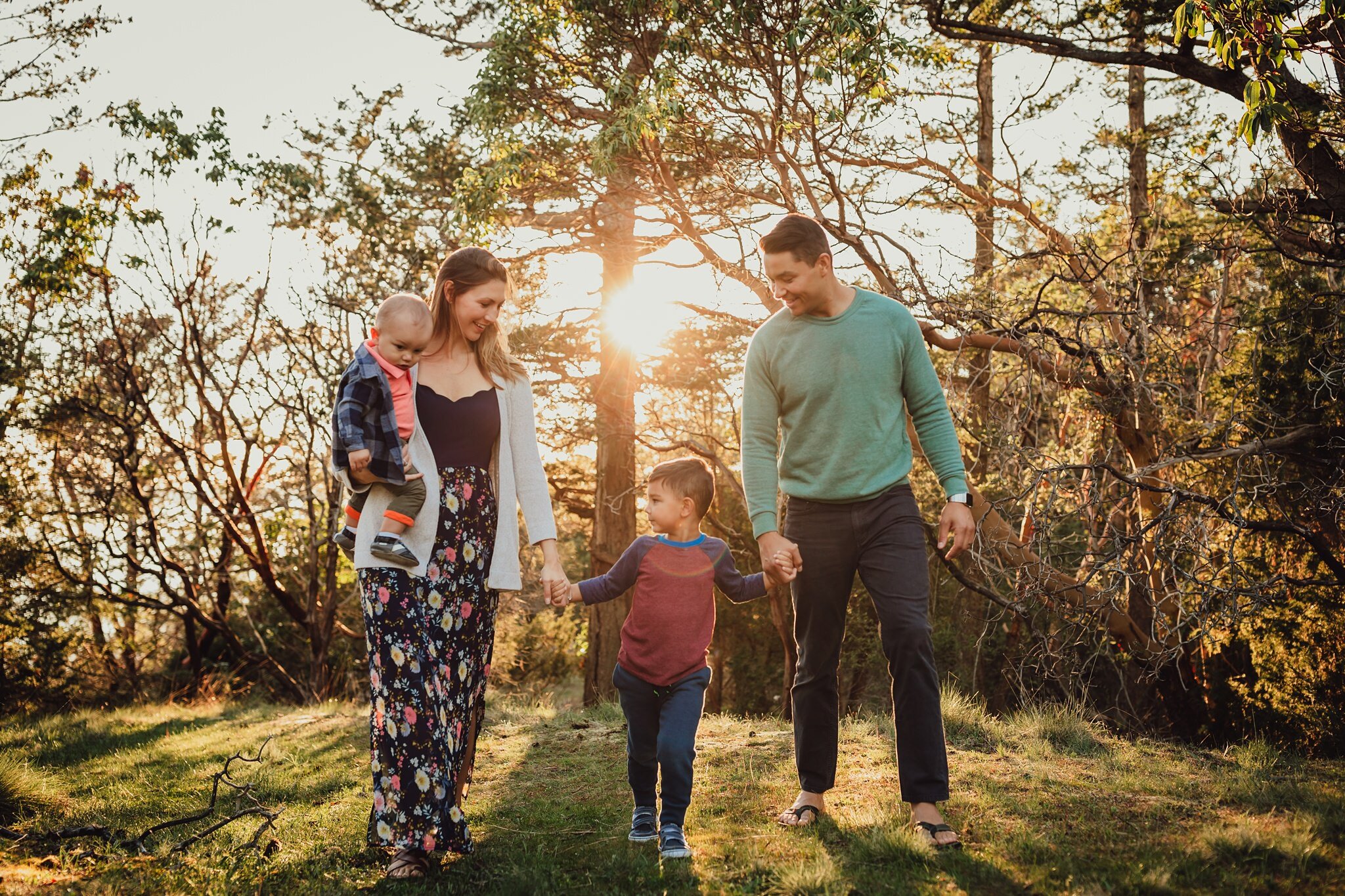 beautiful light as family walks through forest