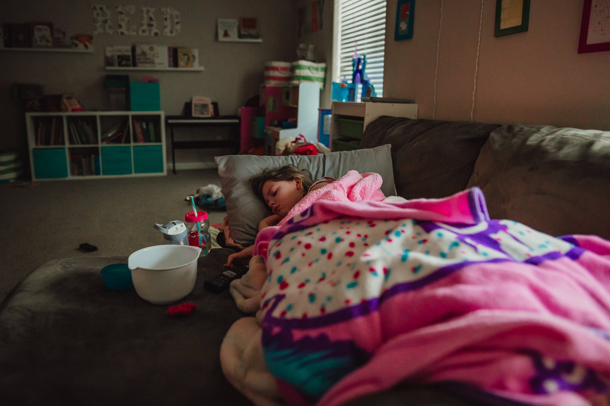 sick girl sleeps on couch