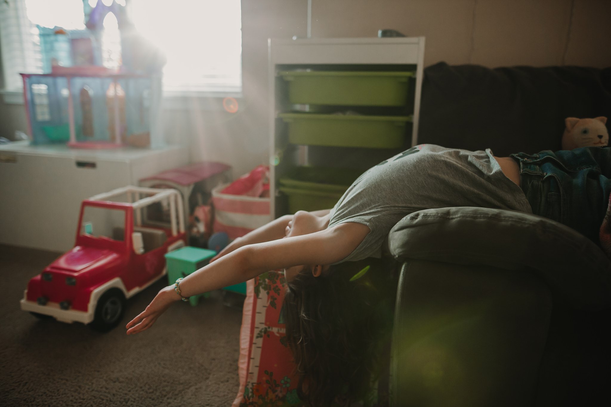 girl stretches on couch