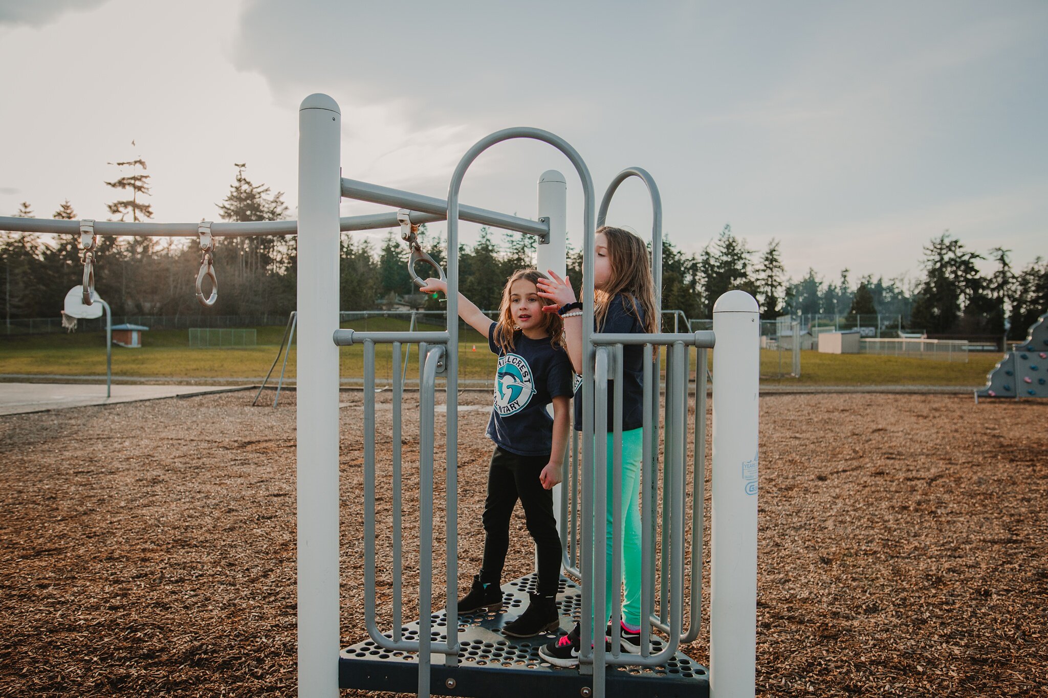 girls stand on playground