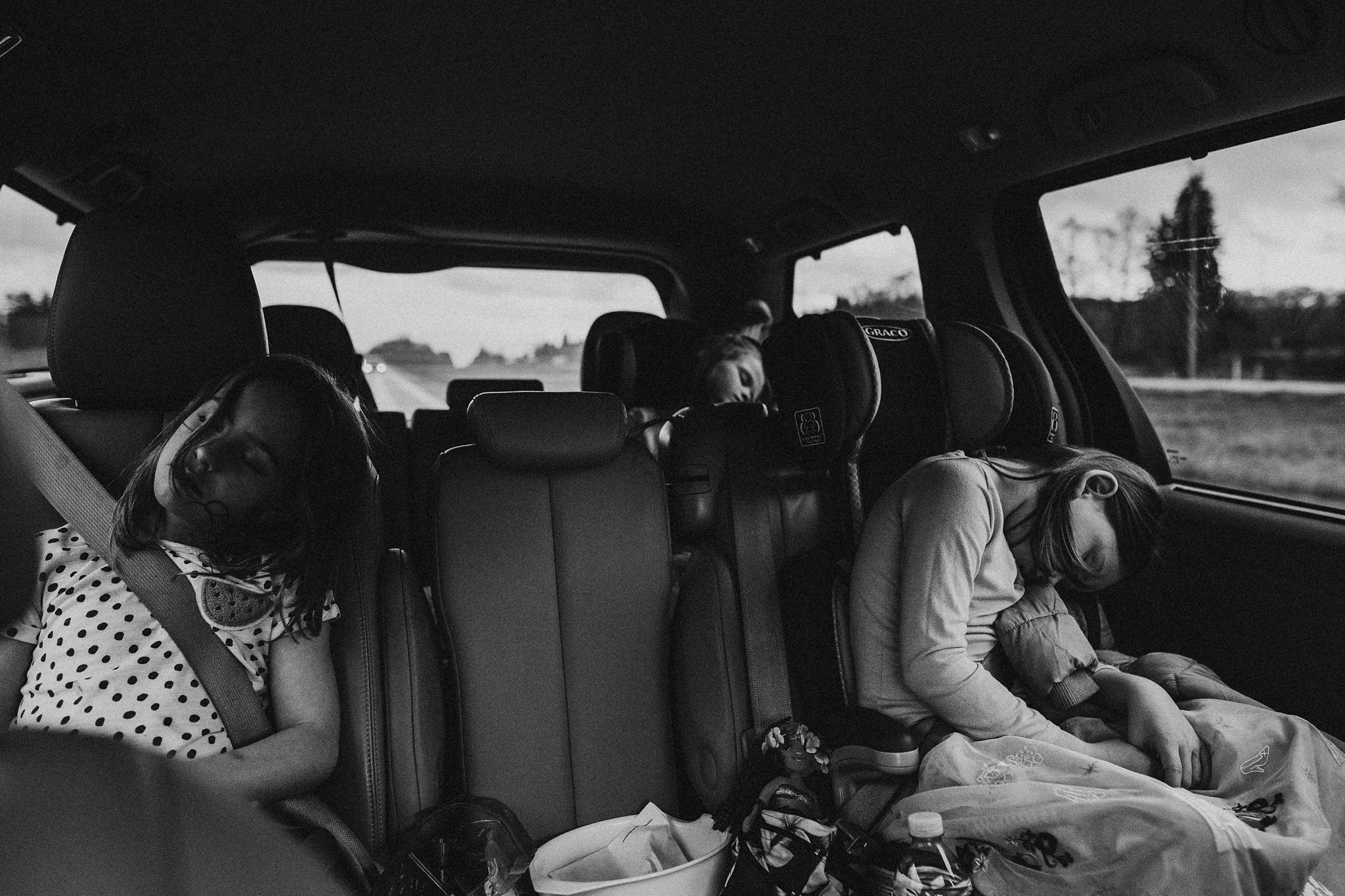 kids sleeping in car