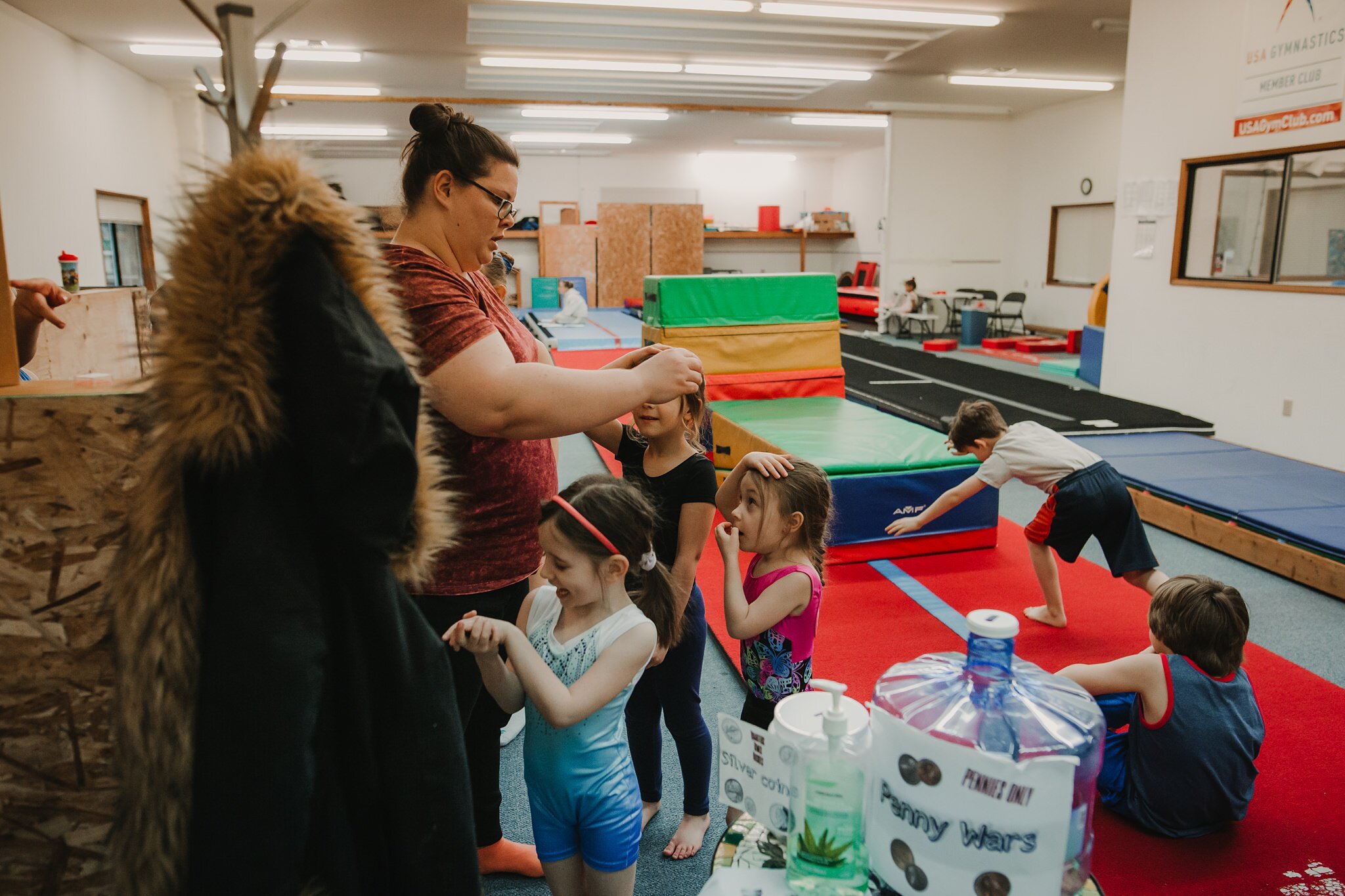 kids get stamps at gymnastics practice