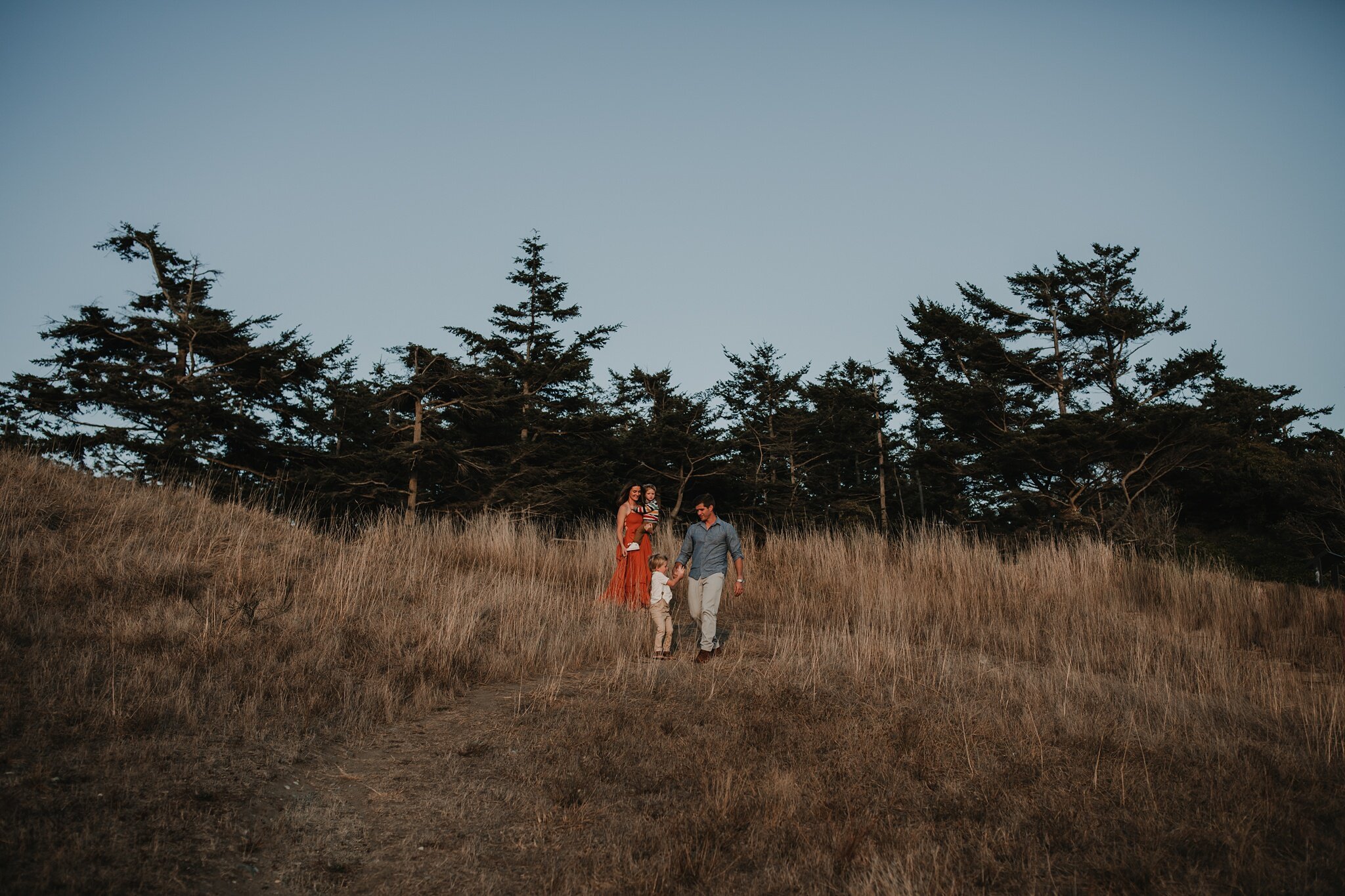 family walks down bluff at fort ebey state park