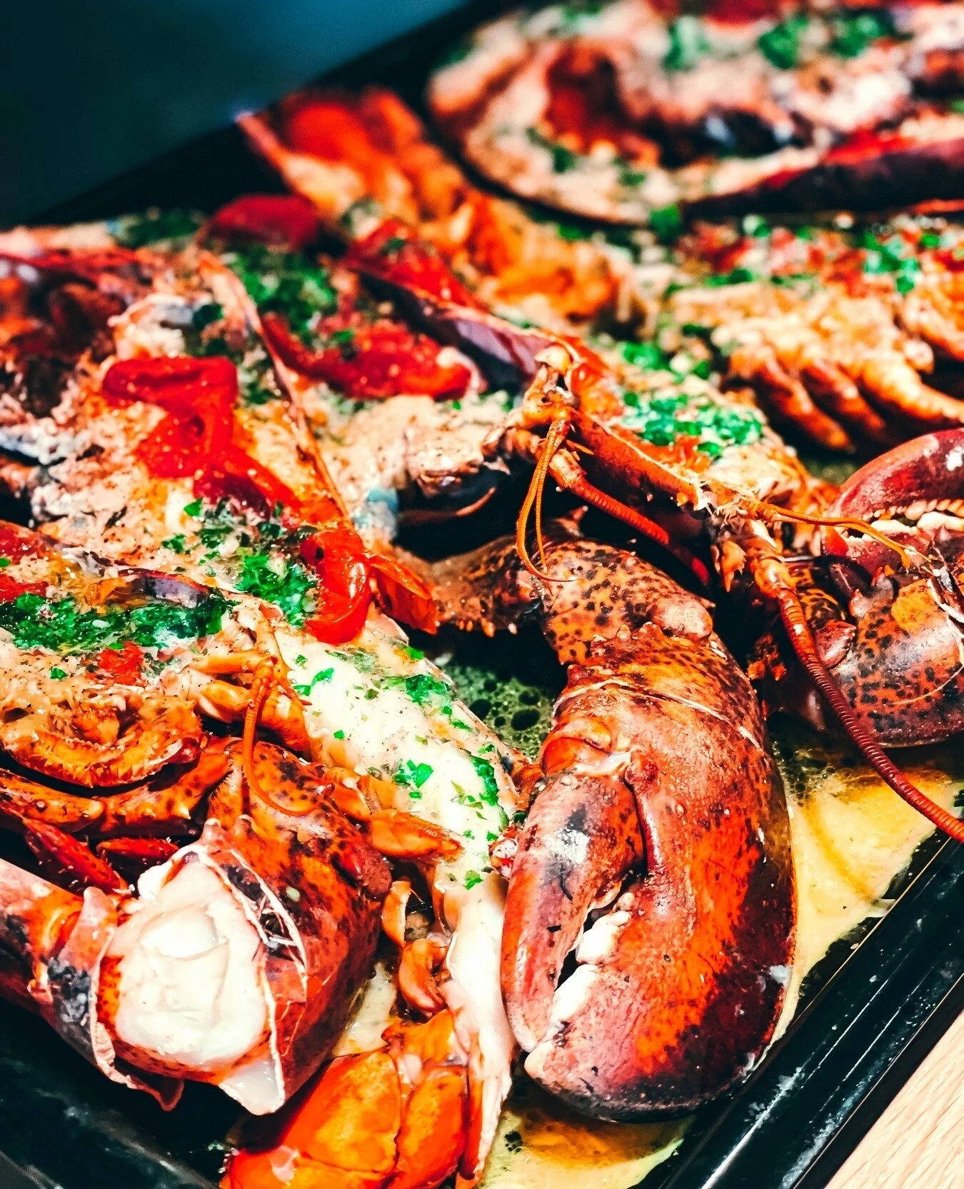A lobster feast is the best feast! 🦞⁠
⁠
Here we paired our lobsters with homemade tarragon butter and confit tomatoes. It's part of our Surf &amp; Turf dinner menu #yumm⁠
⁠
We love to travel and taste all the world has to offer us. Our very first tr